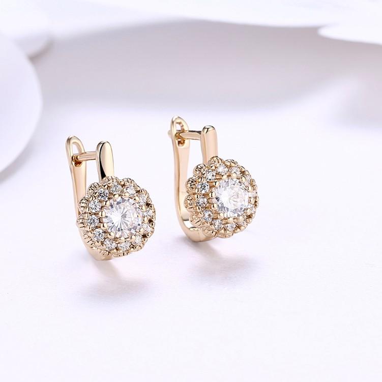 Austrian Crystal Micro Pav'e Bursting Star Leverback Earrings featuring 18K gold plating and a sparkling design.