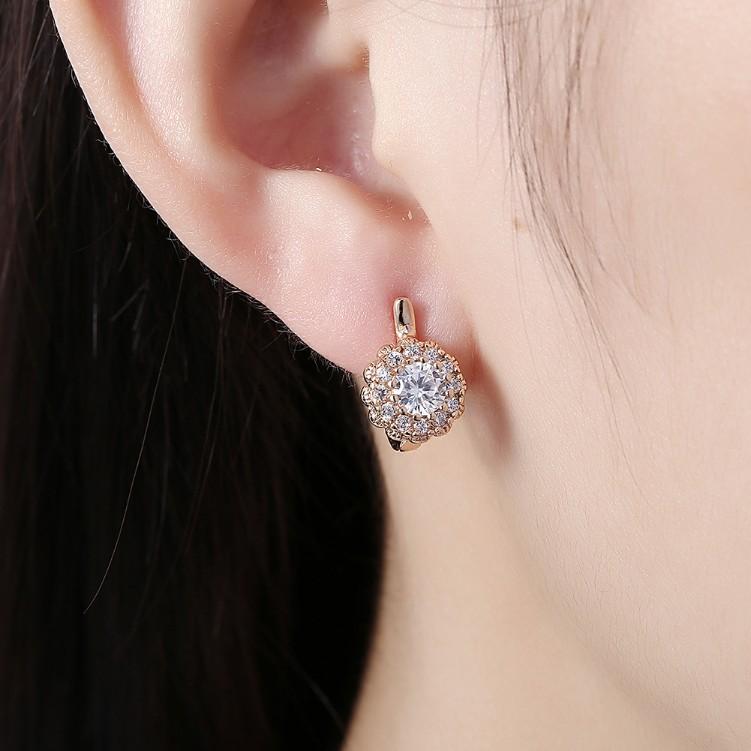 Austrian Crystal Micro Pav'e Bursting Star Leverback Earrings featuring 18K gold plating and a sparkling design.