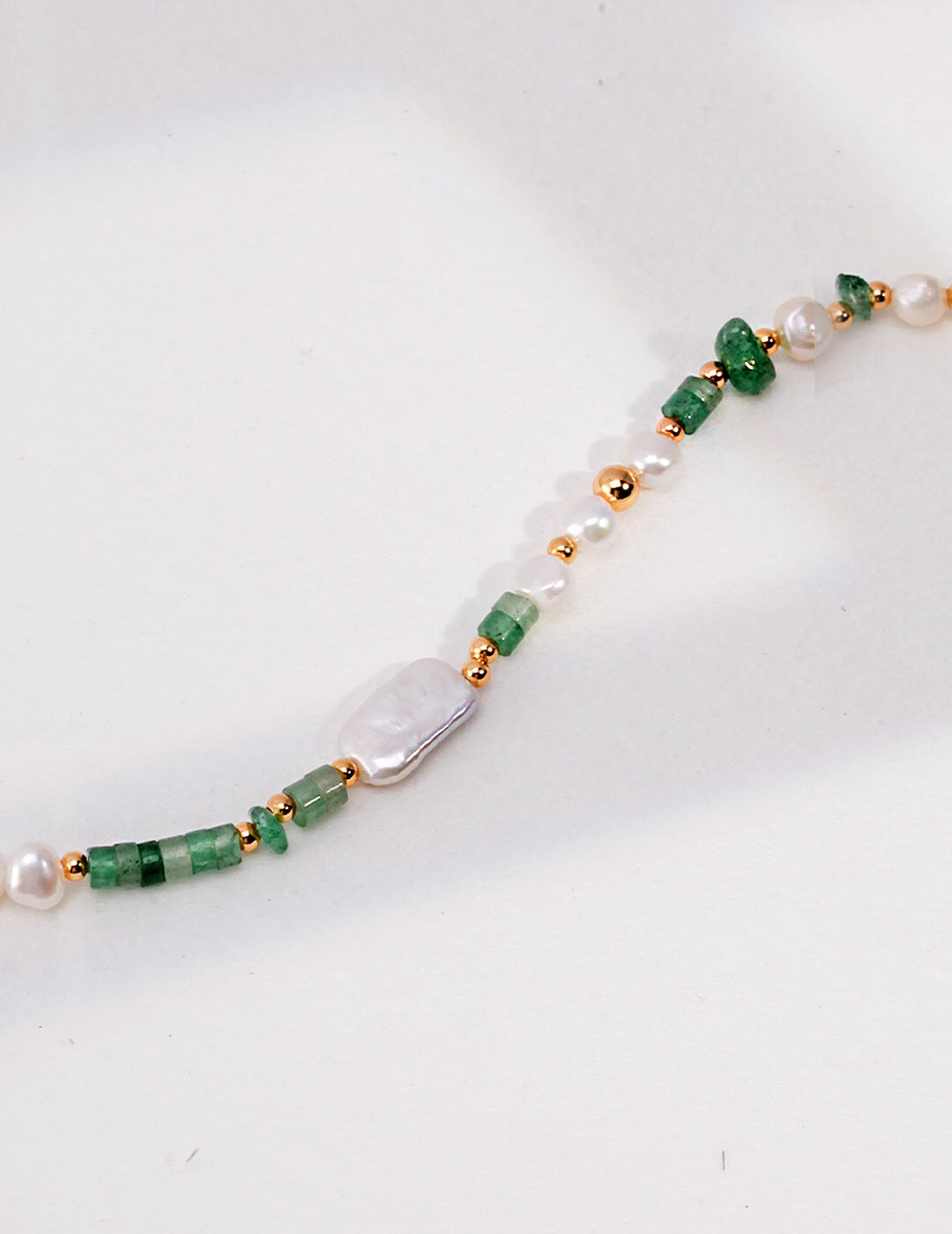 A stunning Aventurine Beads with Pearl Necklace featuring natural pearls and gold vermeil accents, elegantly displayed on a soft background.