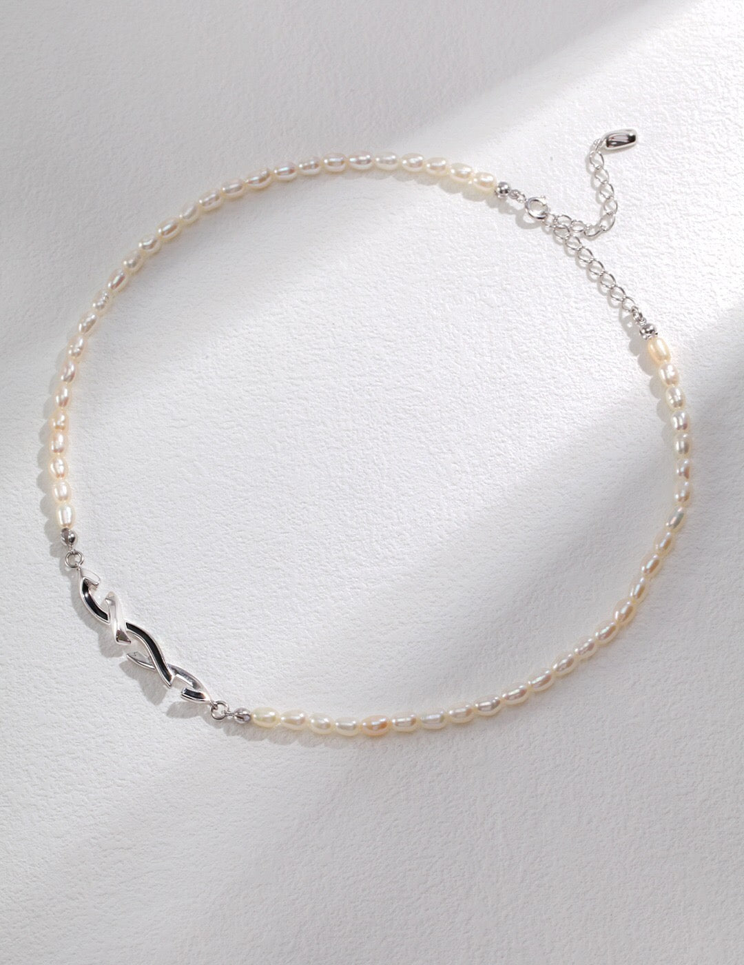 Awareness Ribbon Geometrical Necklace featuring natural pearls and sterling silver, elegantly designed for meaningful expression.