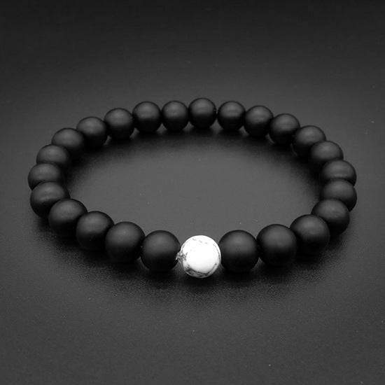 Ayokayishu Japanese Marble Chakra Bracelet featuring black and white marble stones on a stretchable brass chain, designed for men.