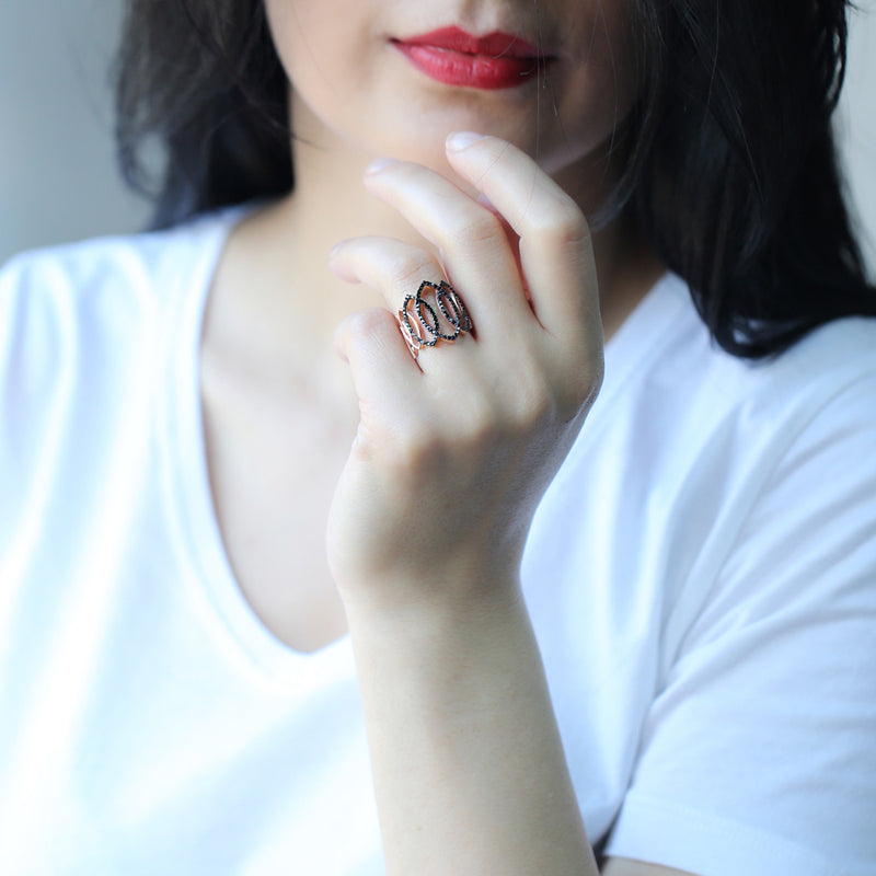 AZAR Ring featuring intricate lace-like loops and sparkling black cubic zirconias, crafted in gold plated sterling silver.