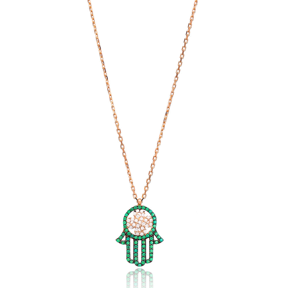 AZRA Hamsa Necklace featuring a filigree pendant with green and white cubic zirconias on a delicate gold-plated sterling silver chain.