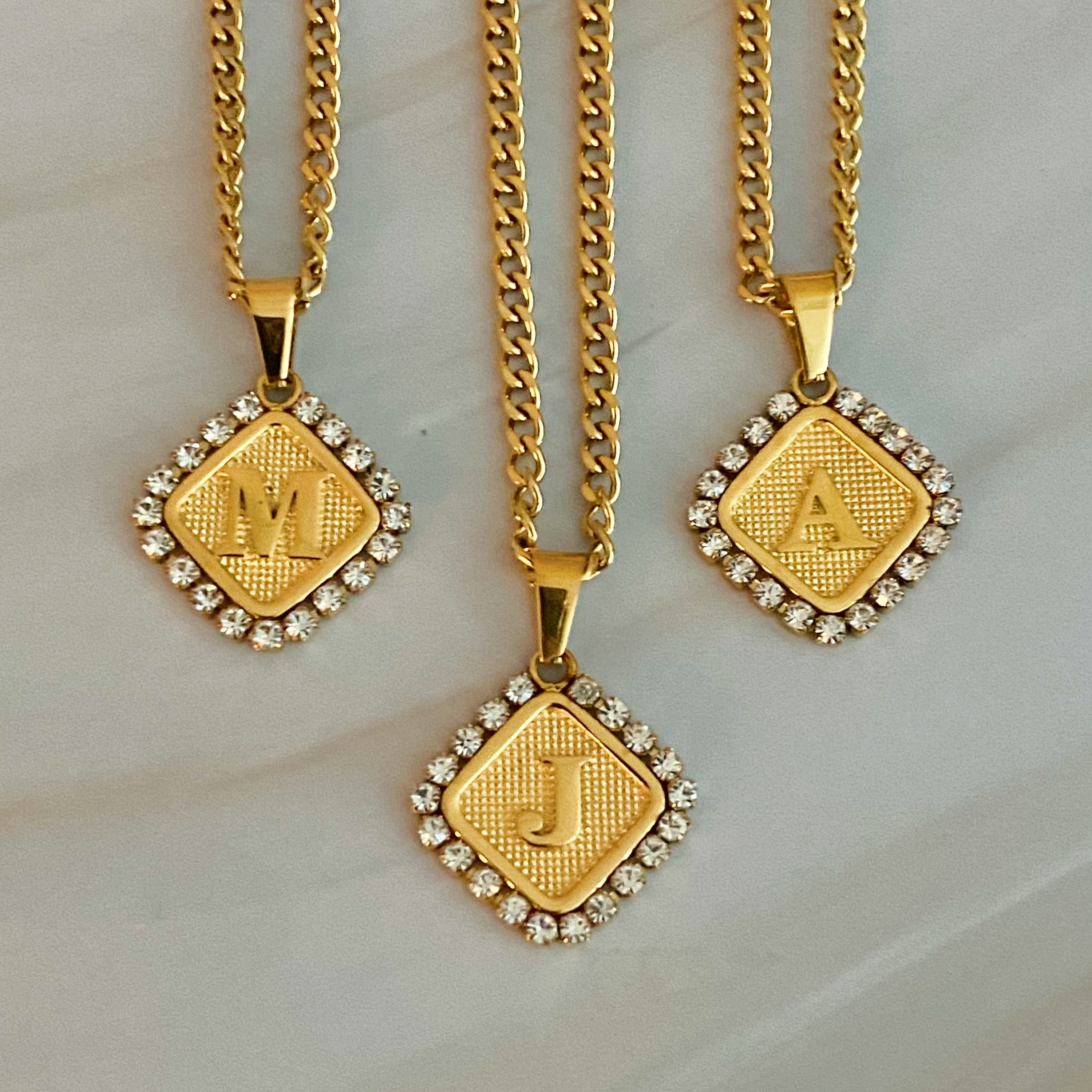 Aztec Delight Initial Necklace featuring a slim Cuban chain and a sparkling initial charm with Cubic Zirconia accents.