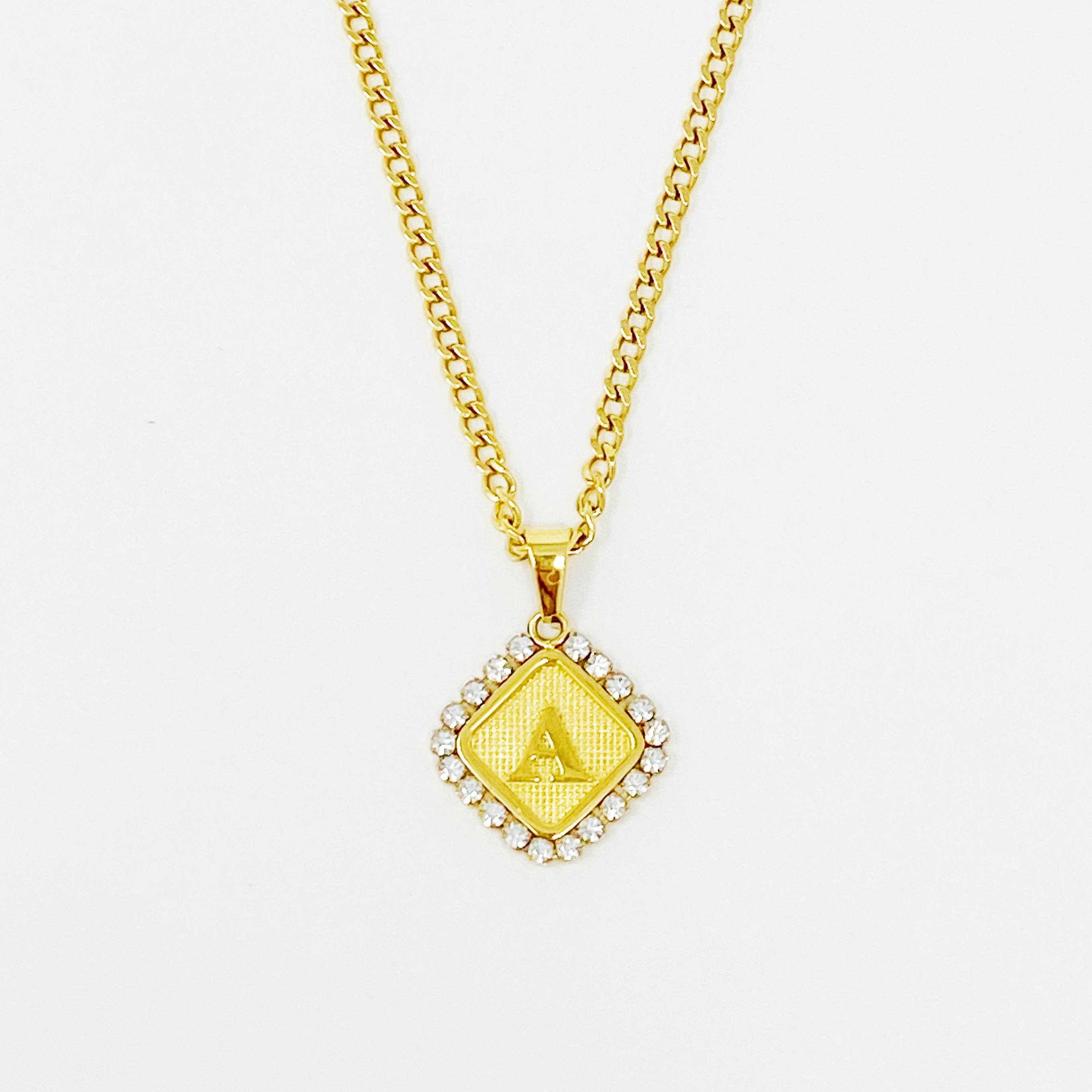 Aztec Delight Initial Necklace featuring a slim Cuban chain and a sparkling initial charm with Cubic Zirconia accents.