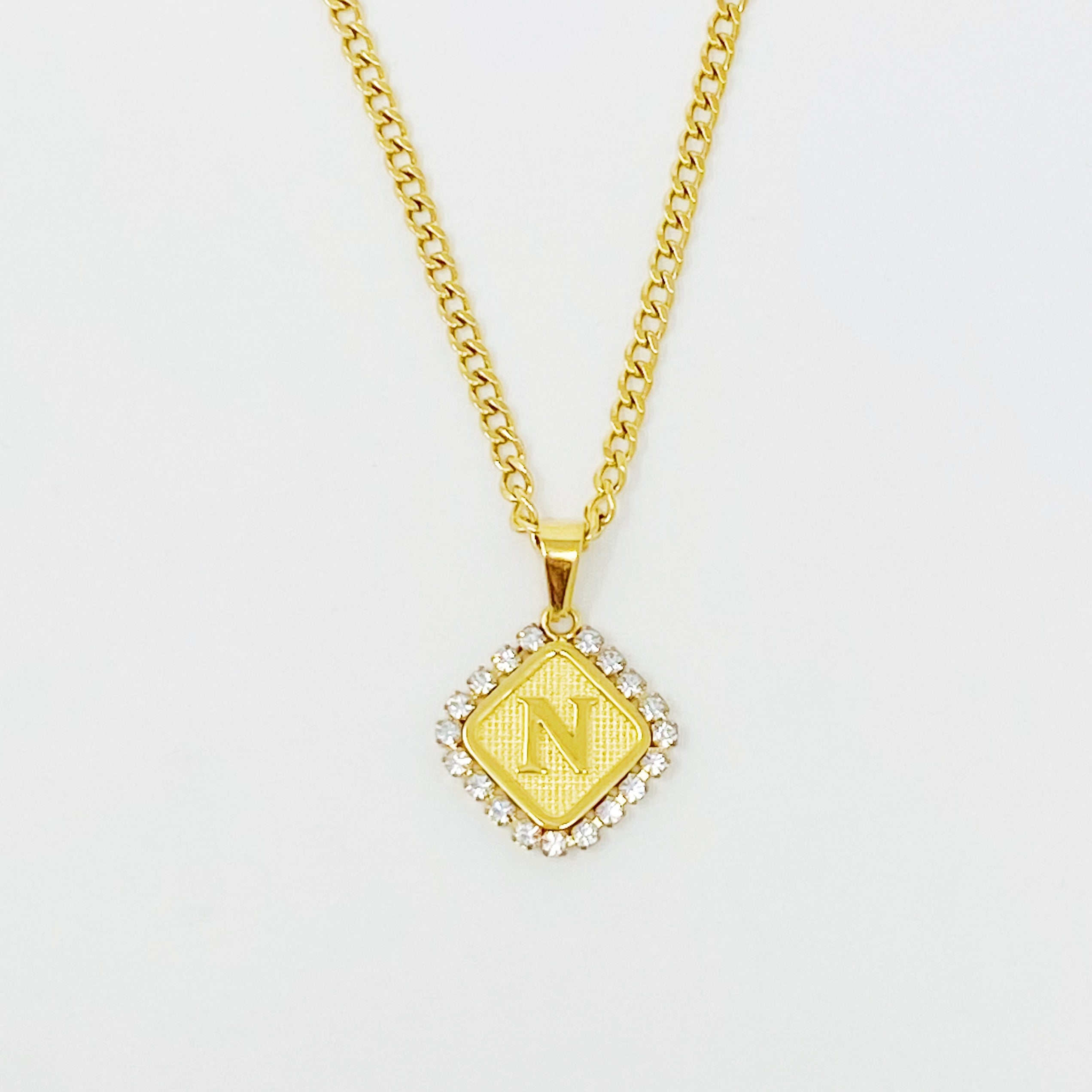 Aztec Delight Initial Necklace featuring a slim Cuban chain and a sparkling initial charm with Cubic Zirconia accents.