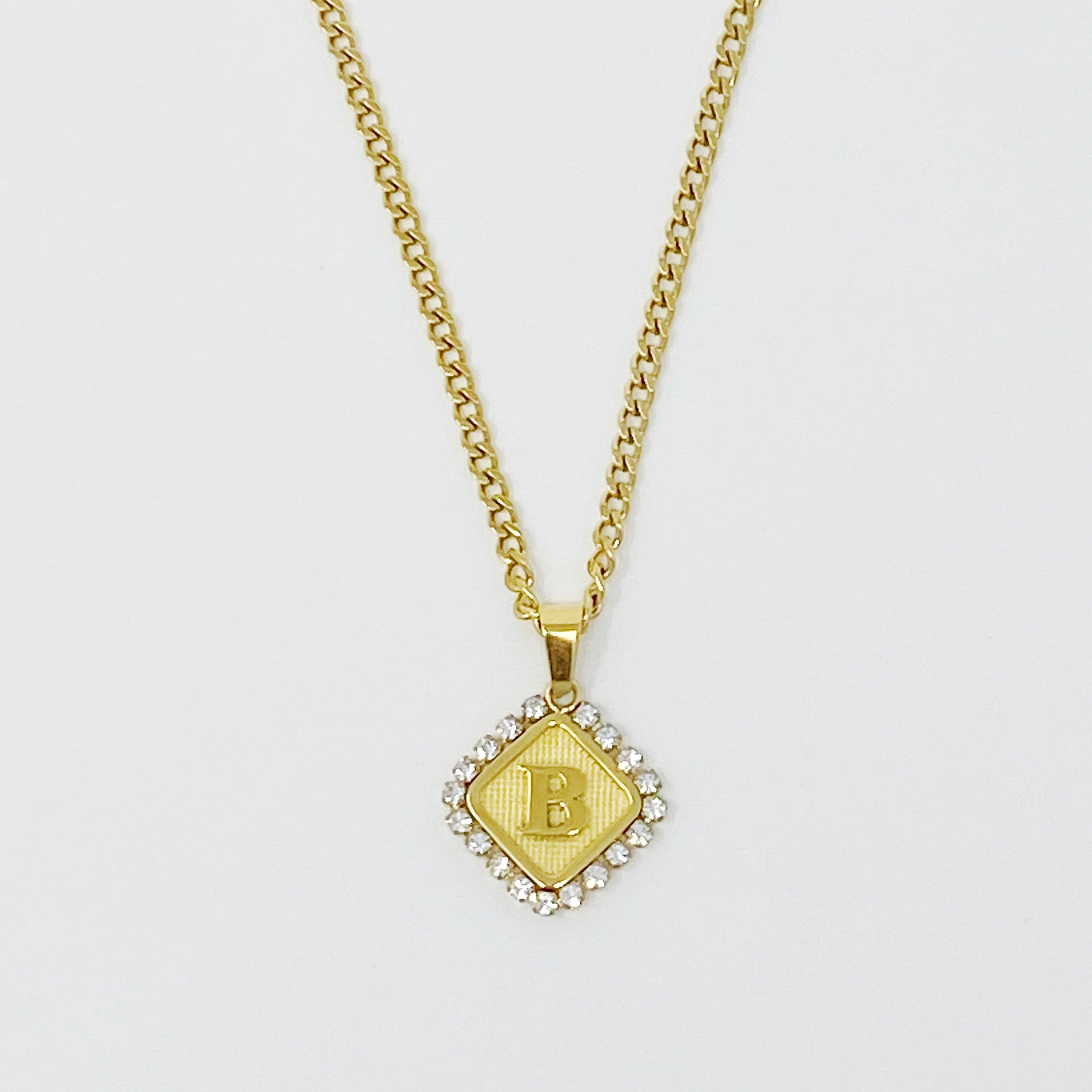 Aztec Delight Initial Necklace featuring a slim Cuban chain and a sparkling initial charm with Cubic Zirconia accents.