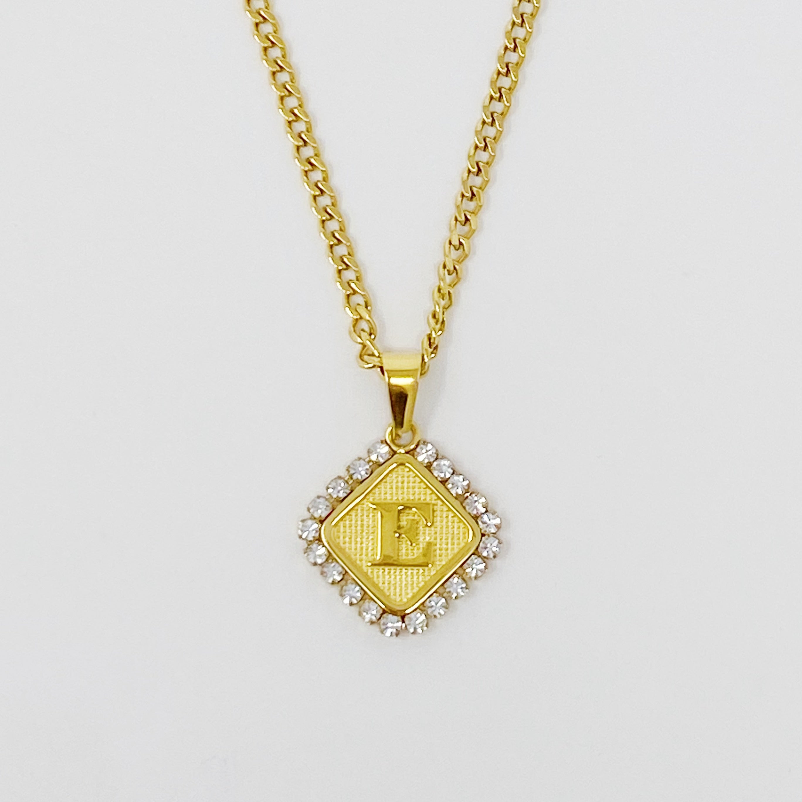 Aztec Delight Initial Necklace featuring a slim Cuban chain and a sparkling initial charm with Cubic Zirconia accents.