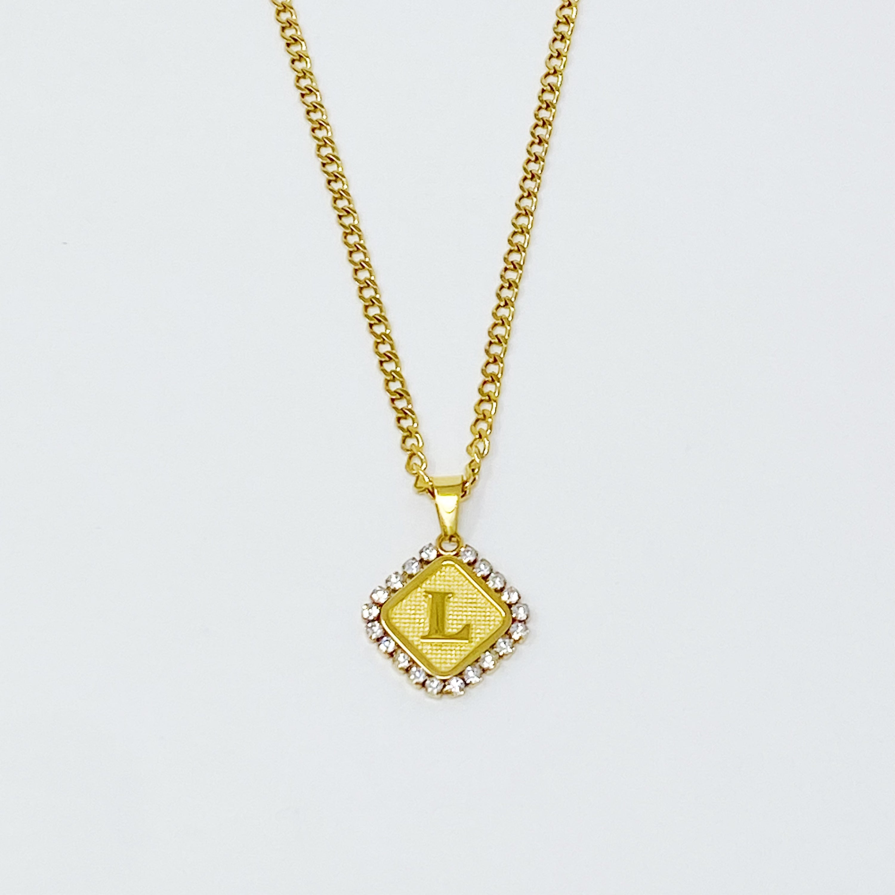 Aztec Delight Initial Necklace featuring a slim Cuban chain and a sparkling initial charm with Cubic Zirconia accents.