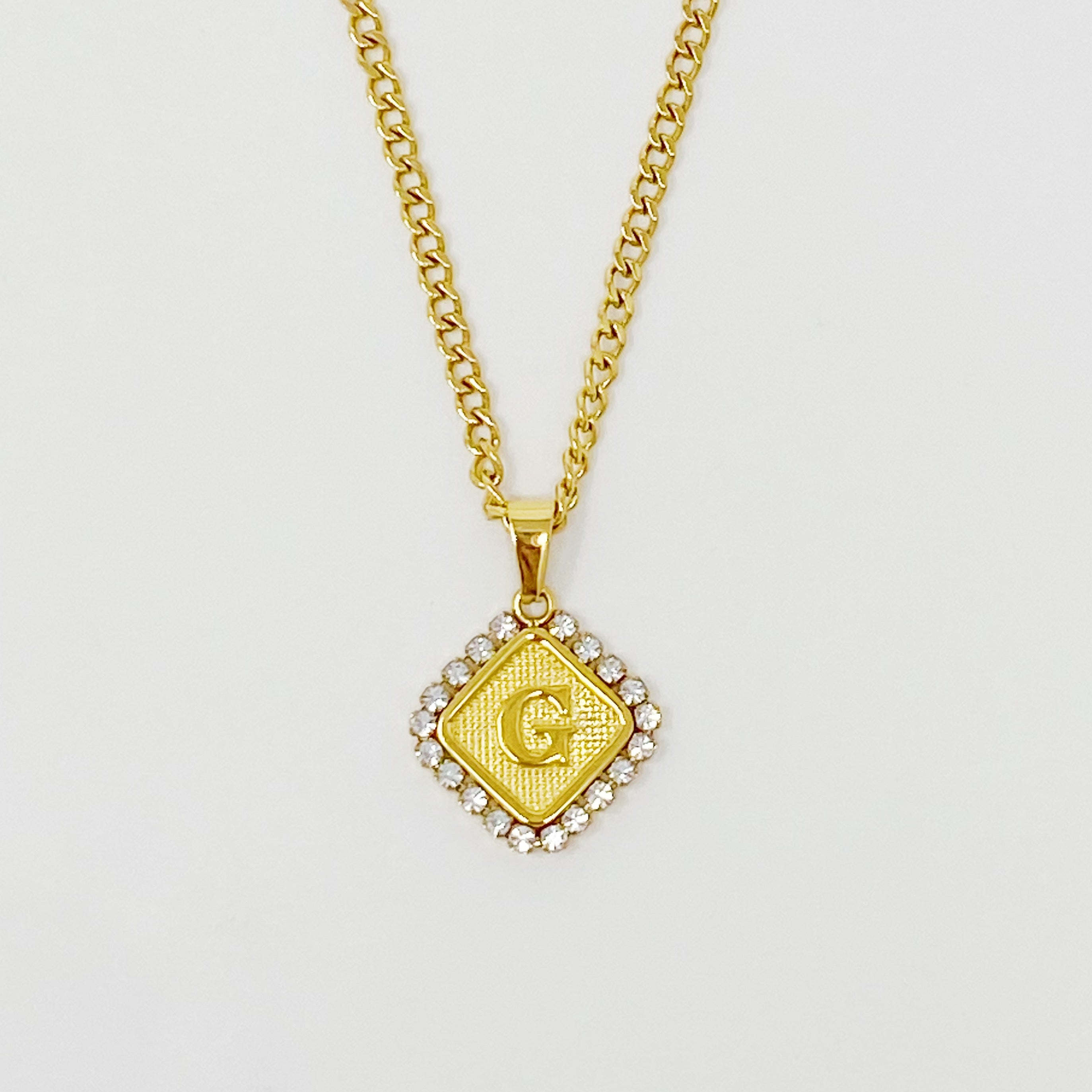 Aztec Delight Initial Necklace featuring a slim Cuban chain and a sparkling initial charm with Cubic Zirconia accents.