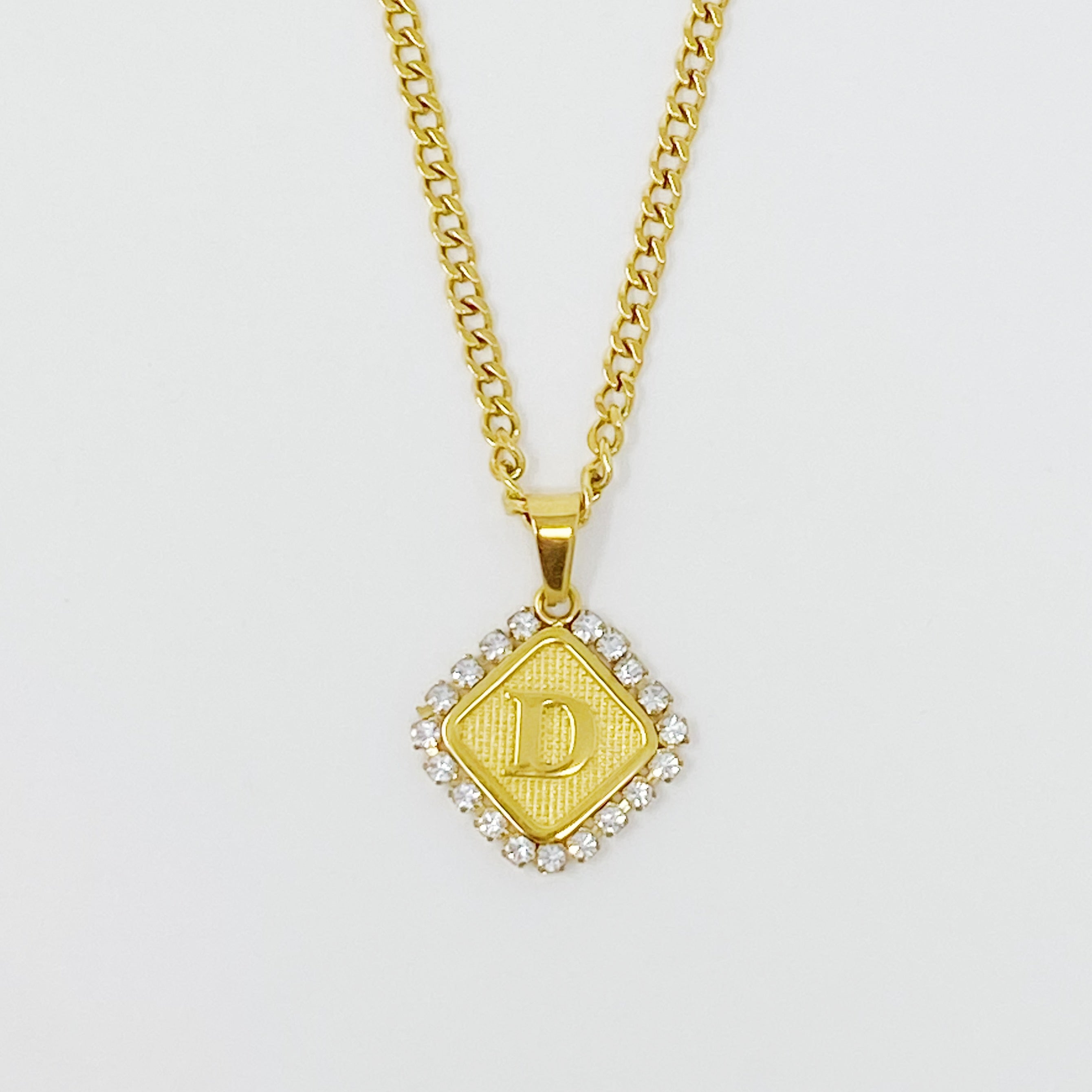 Aztec Delight Initial Necklace featuring a slim Cuban chain and a sparkling initial charm with Cubic Zirconia accents.