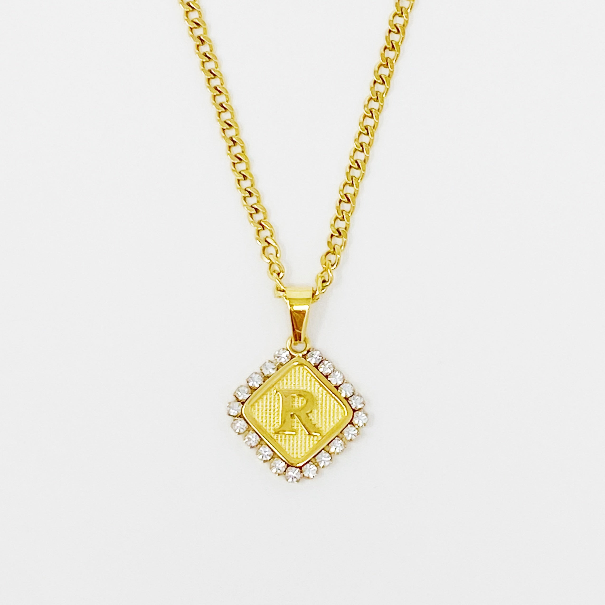 Aztec Delight Initial Necklace featuring a slim Cuban chain and a sparkling initial charm with Cubic Zirconia accents.