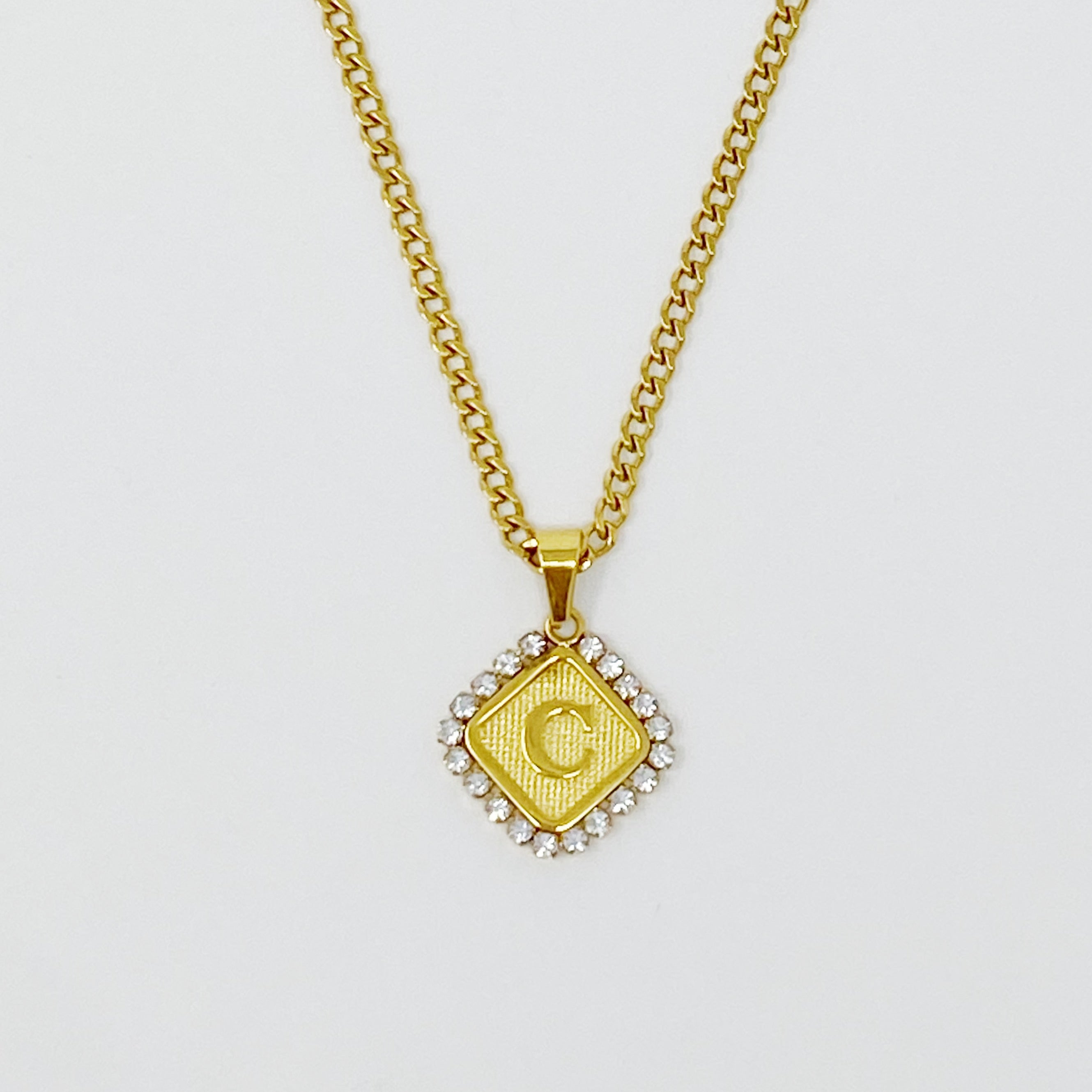 Aztec Delight Initial Necklace featuring a slim Cuban chain and a sparkling initial charm with Cubic Zirconia accents.