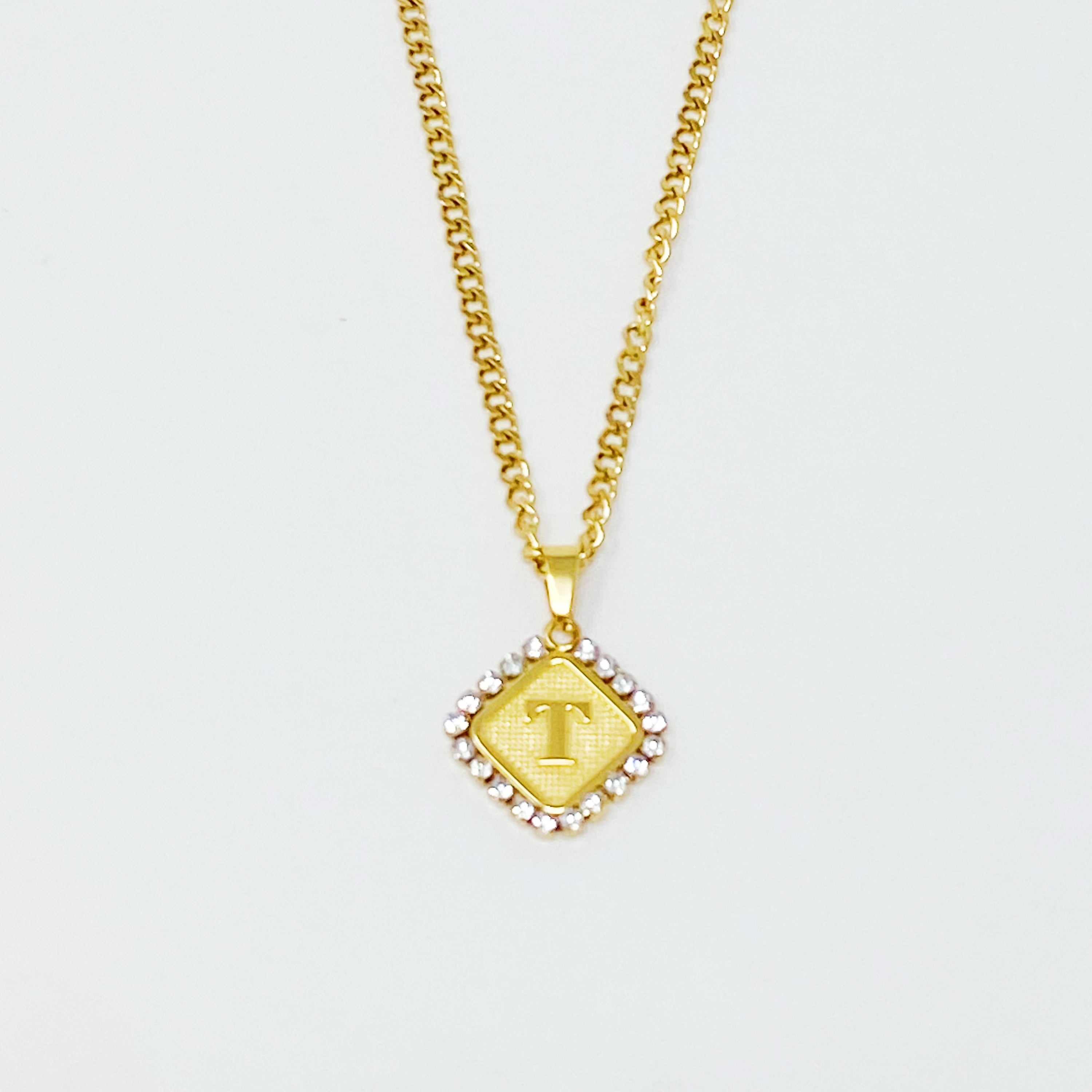 Aztec Delight Initial Necklace featuring a slim Cuban chain and a sparkling initial charm with Cubic Zirconia accents.