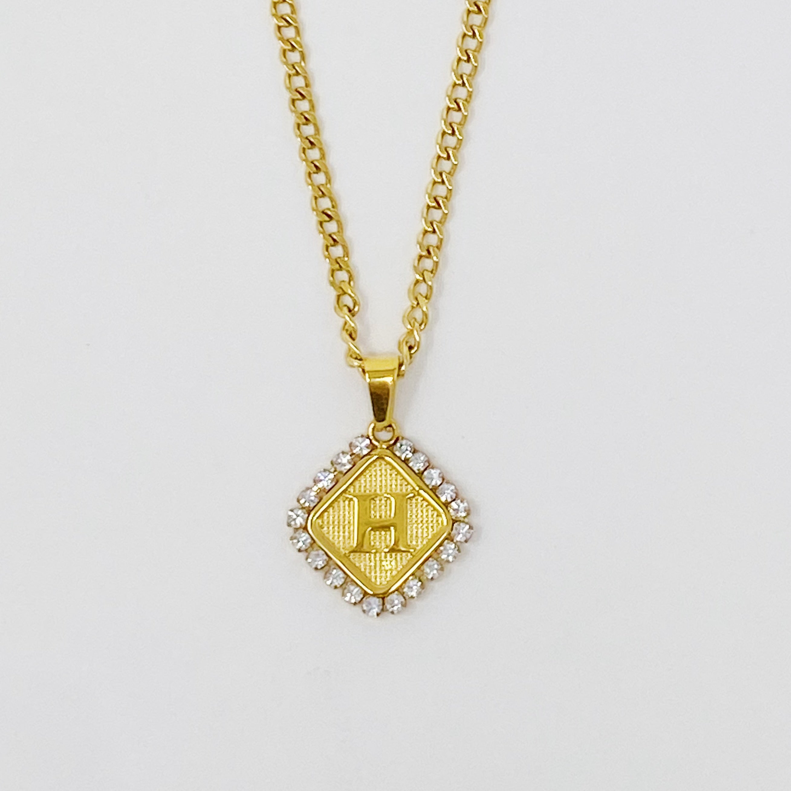 Aztec Delight Initial Necklace featuring a slim Cuban chain and a sparkling initial charm with Cubic Zirconia accents.