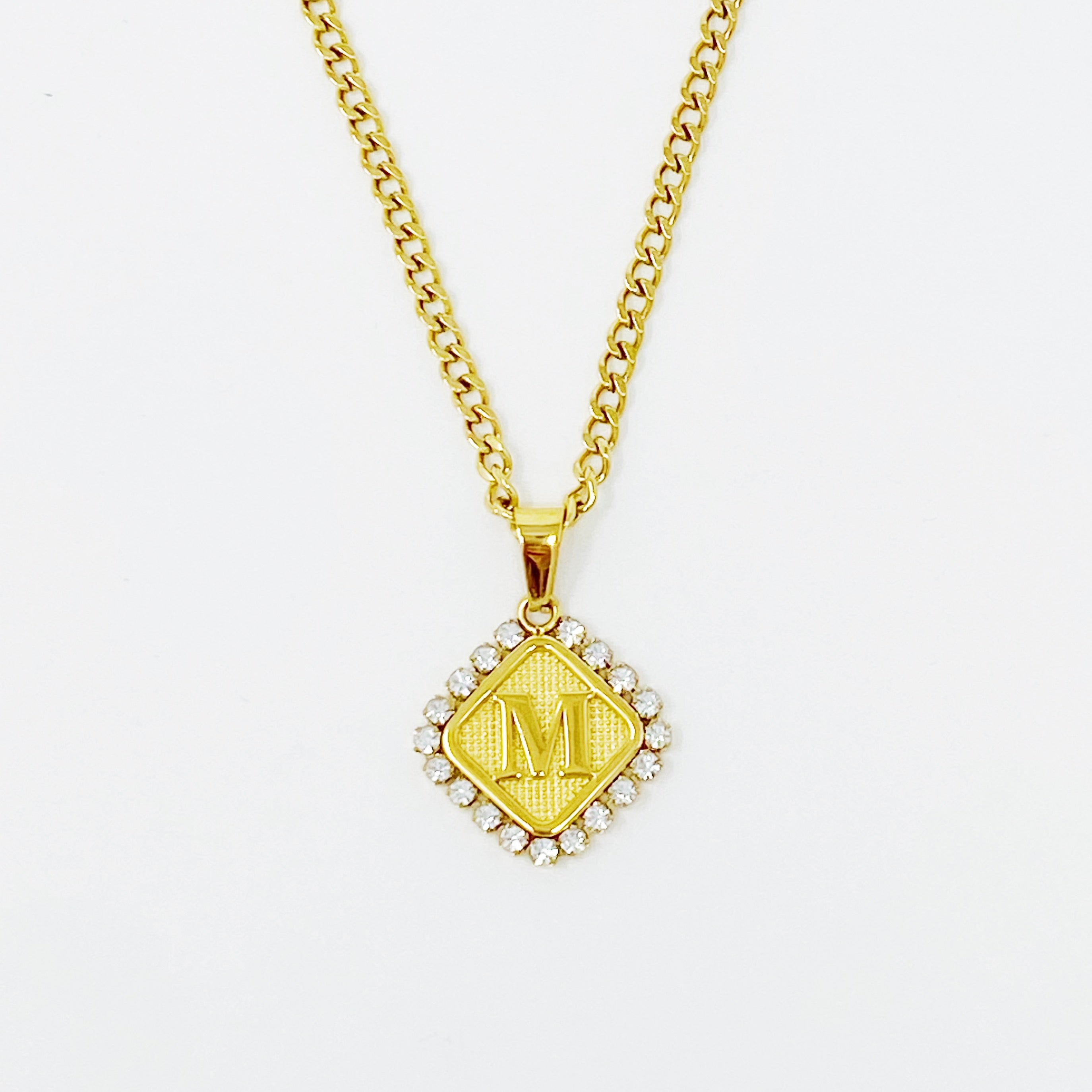 Aztec Delight Initial Necklace featuring a slim Cuban chain and a sparkling initial charm with Cubic Zirconia accents.