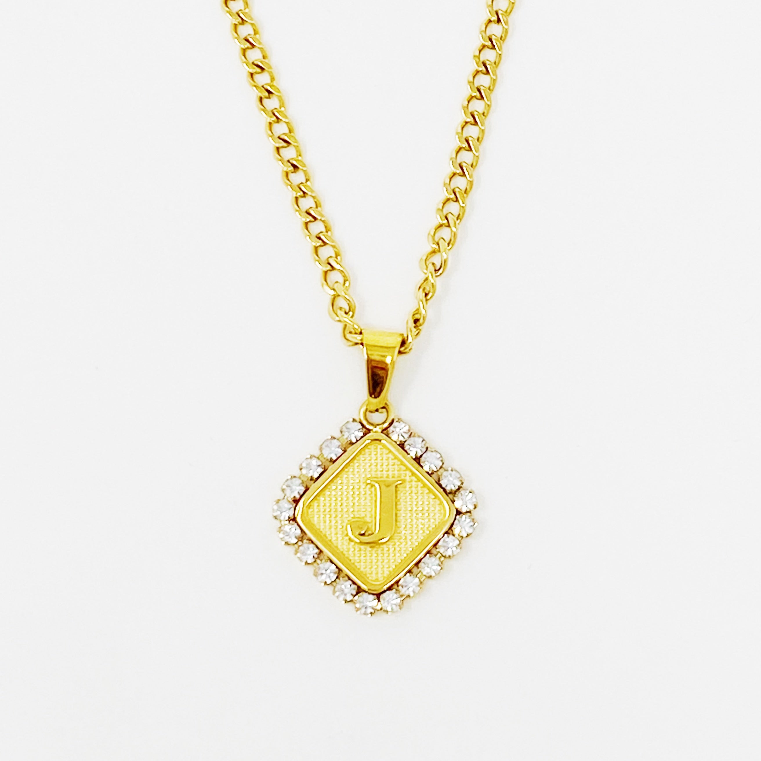 Aztec Delight Initial Necklace featuring a slim Cuban chain and a sparkling initial charm with Cubic Zirconia accents.