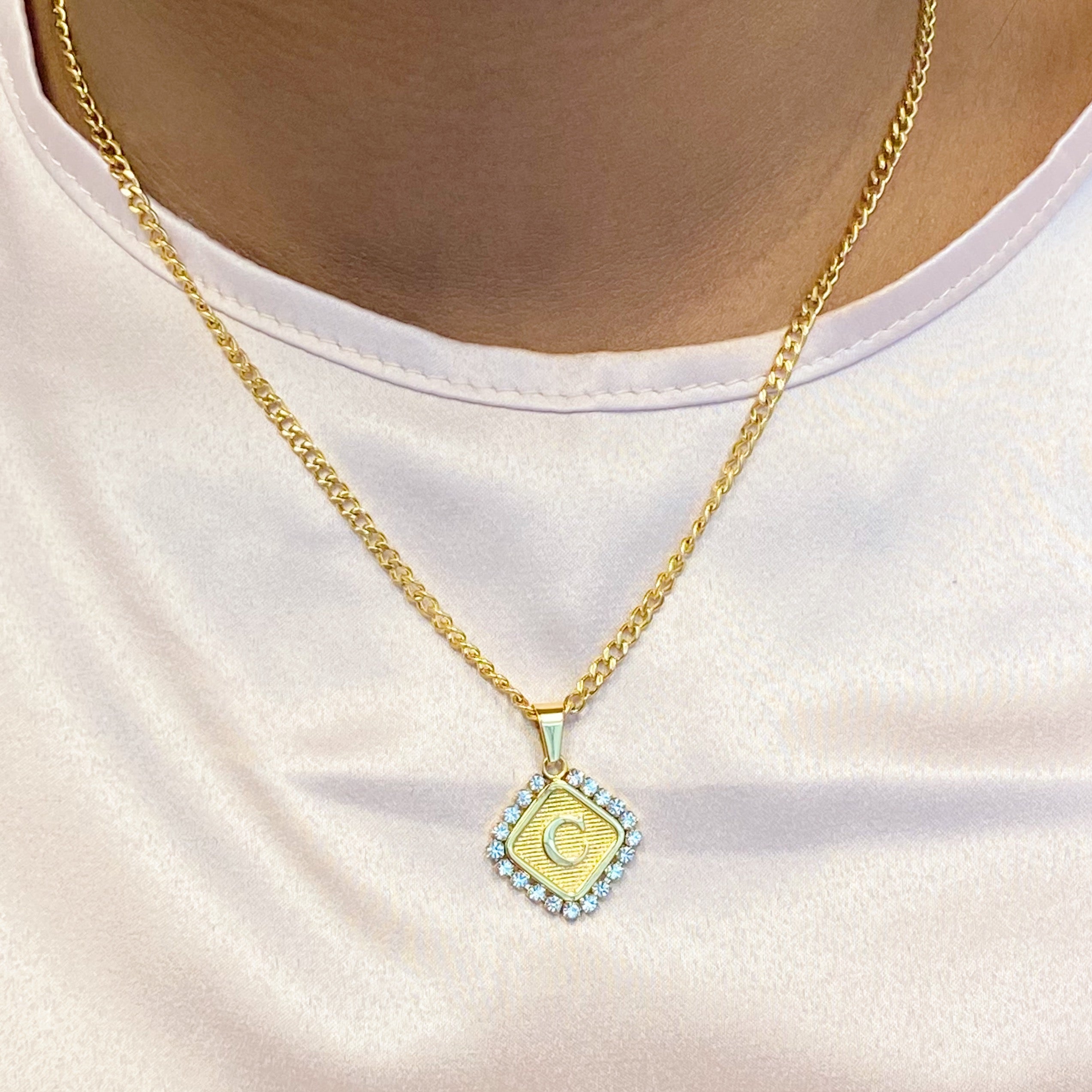 Aztec Delight Initial Necklace featuring a slim Cuban chain and a sparkling initial charm with Cubic Zirconia accents.