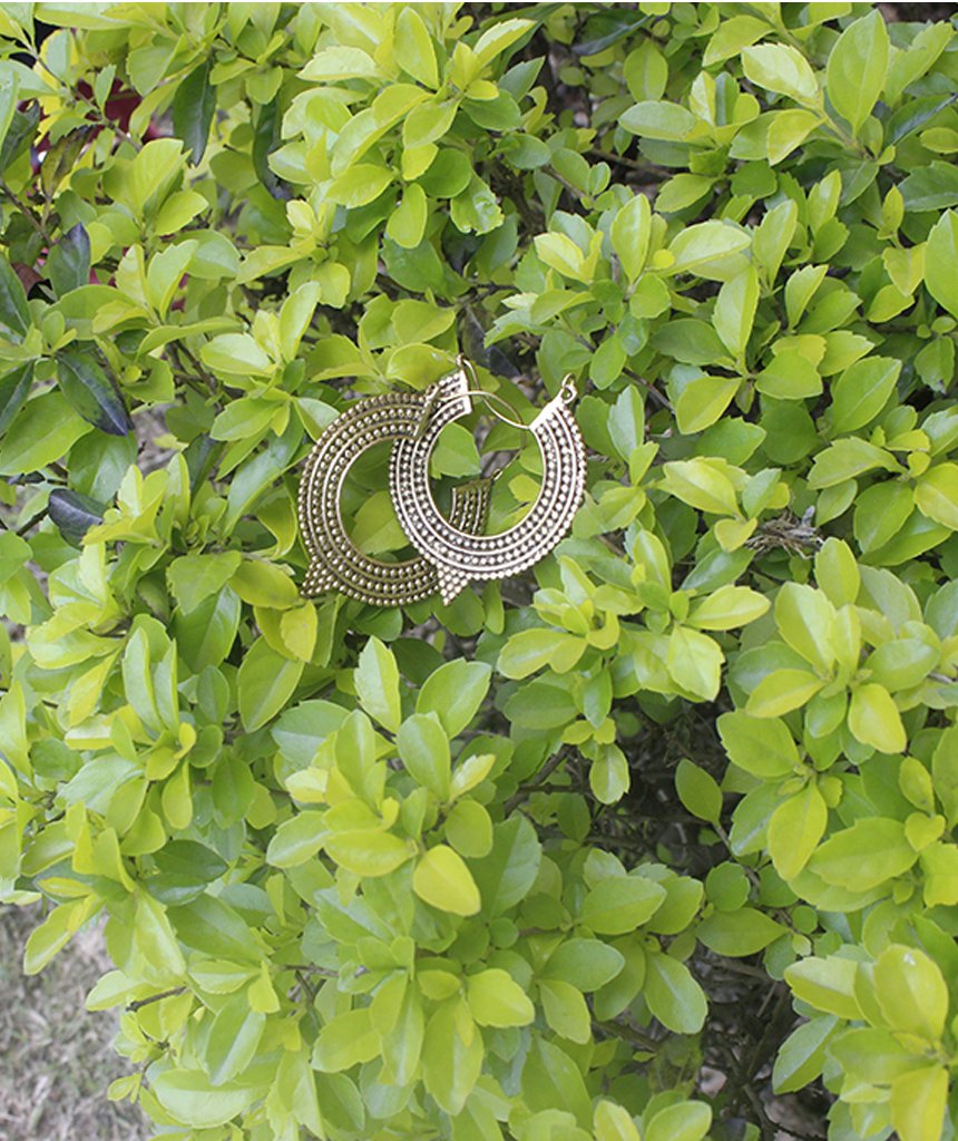 A pair of Aztec Hoop Earrings featuring intricate brass designs, available in three sizes, perfect for sensitive skin.