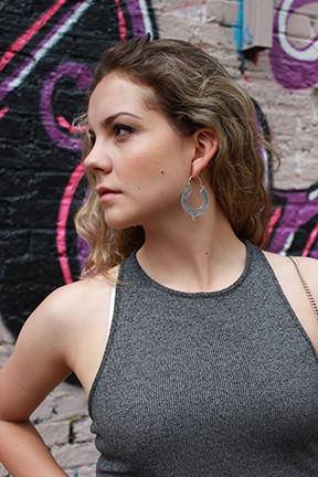 A pair of Aztec Hoop Earrings featuring intricate brass designs, available in three sizes, perfect for sensitive skin.