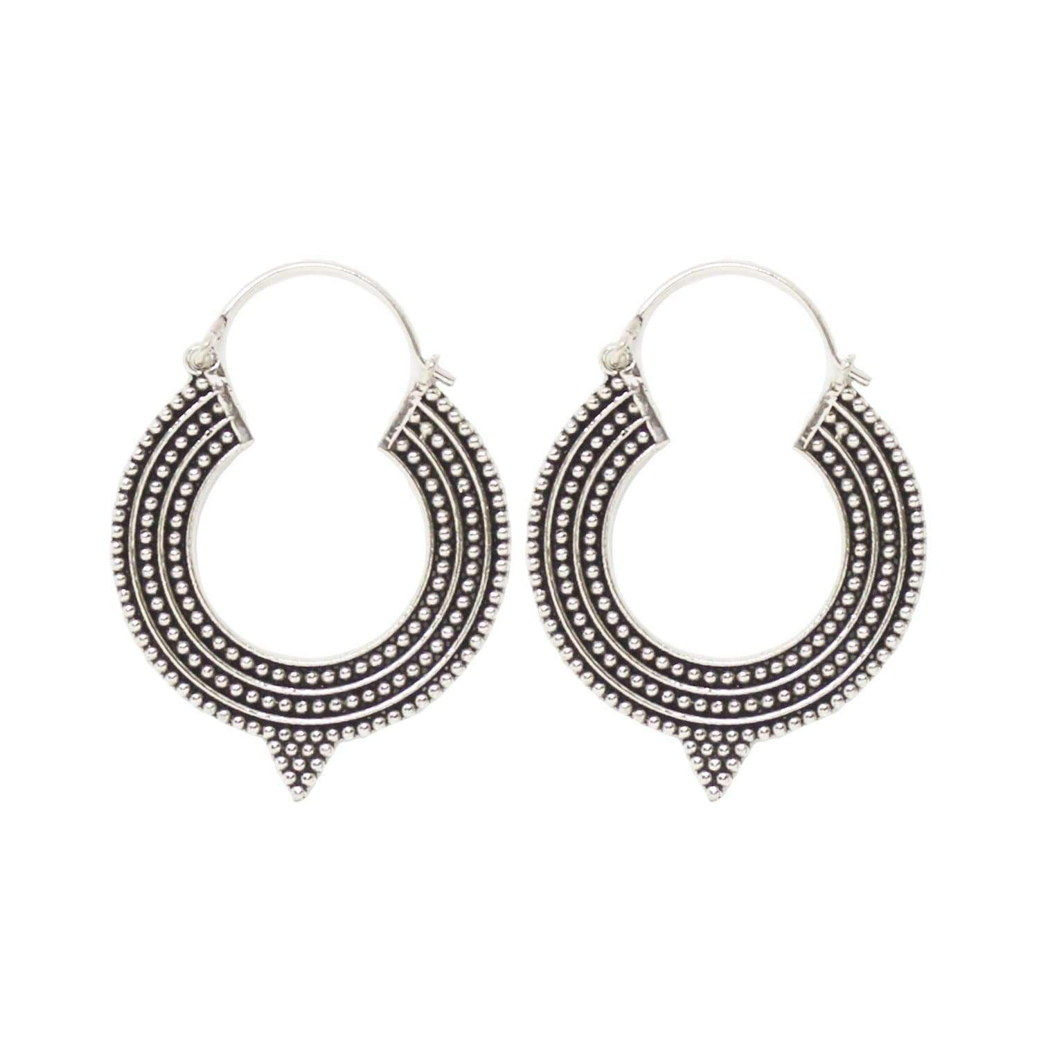 A pair of Aztec Hoop Earrings featuring intricate brass designs, available in three sizes, perfect for sensitive skin.