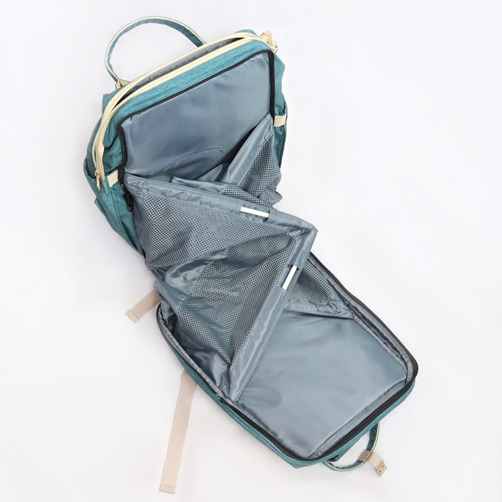 A stylish Baby Crib Backpack showcasing its multi-functional design, featuring a diaper compartment, insulated bottle pocket, and crib setup.