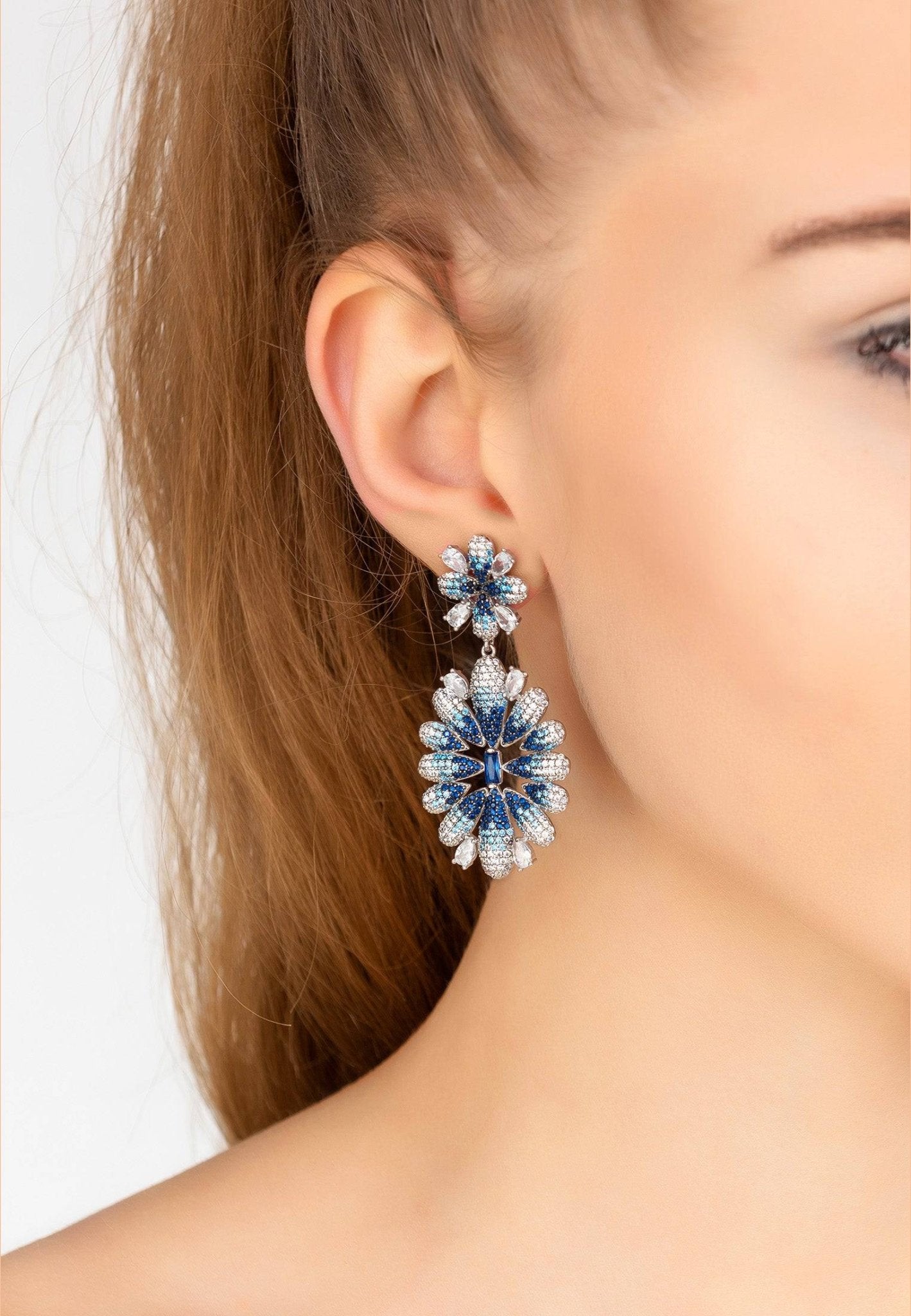 Babylon Ice Blue Gradient Flower Drop Earrings in silver featuring intricate floral design with sapphire blue and white zircon gemstones.