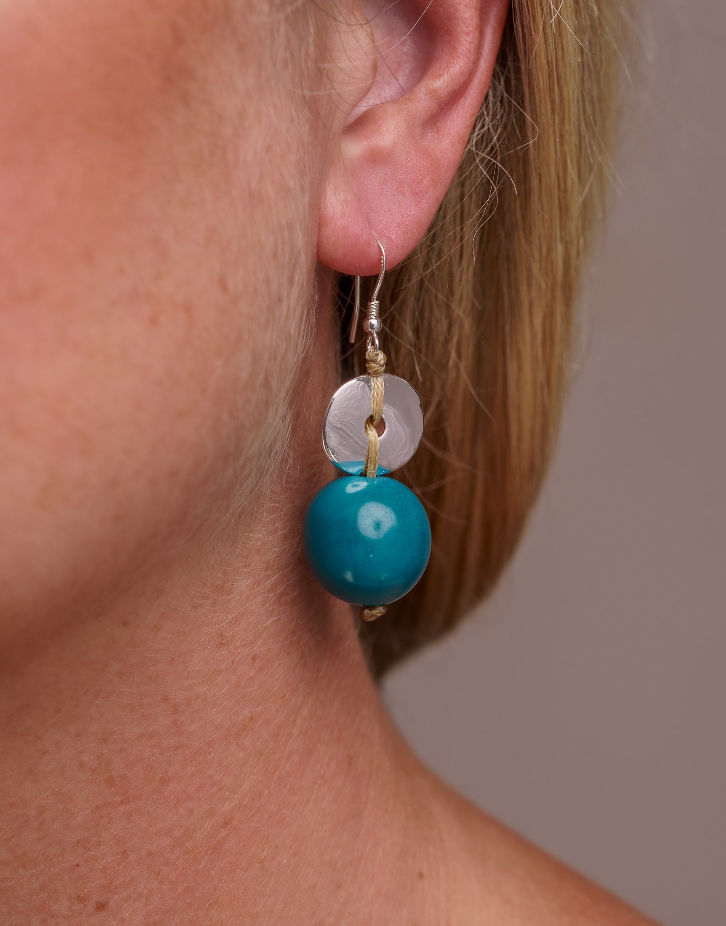 Baiana Bombona Earrings made from Vegetable Ivory and silver, featuring a round shape and sterling silver hooks.