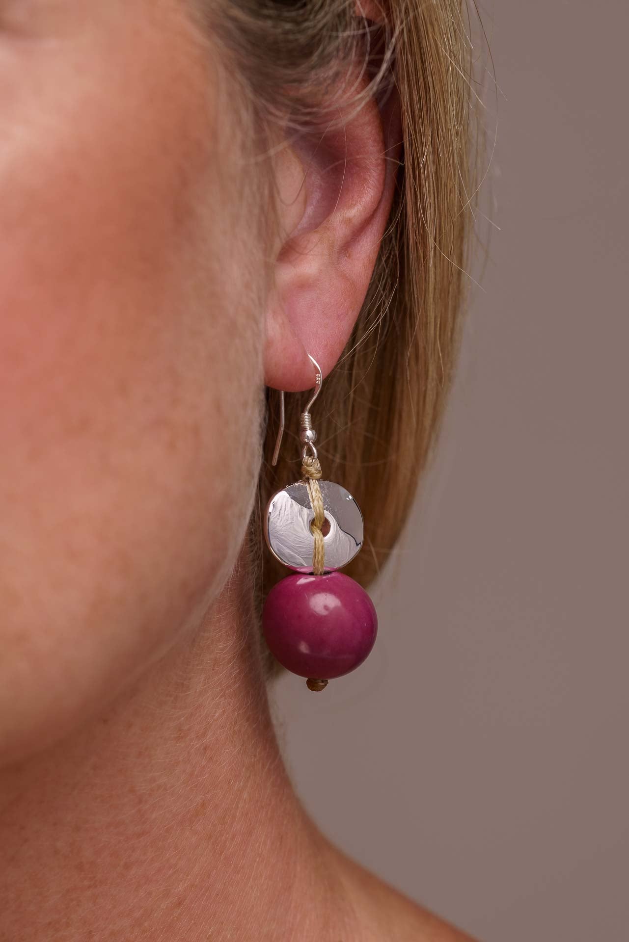 Baiana Bombona Earrings made from Vegetable Ivory and silver, featuring a round shape and sterling silver hooks.