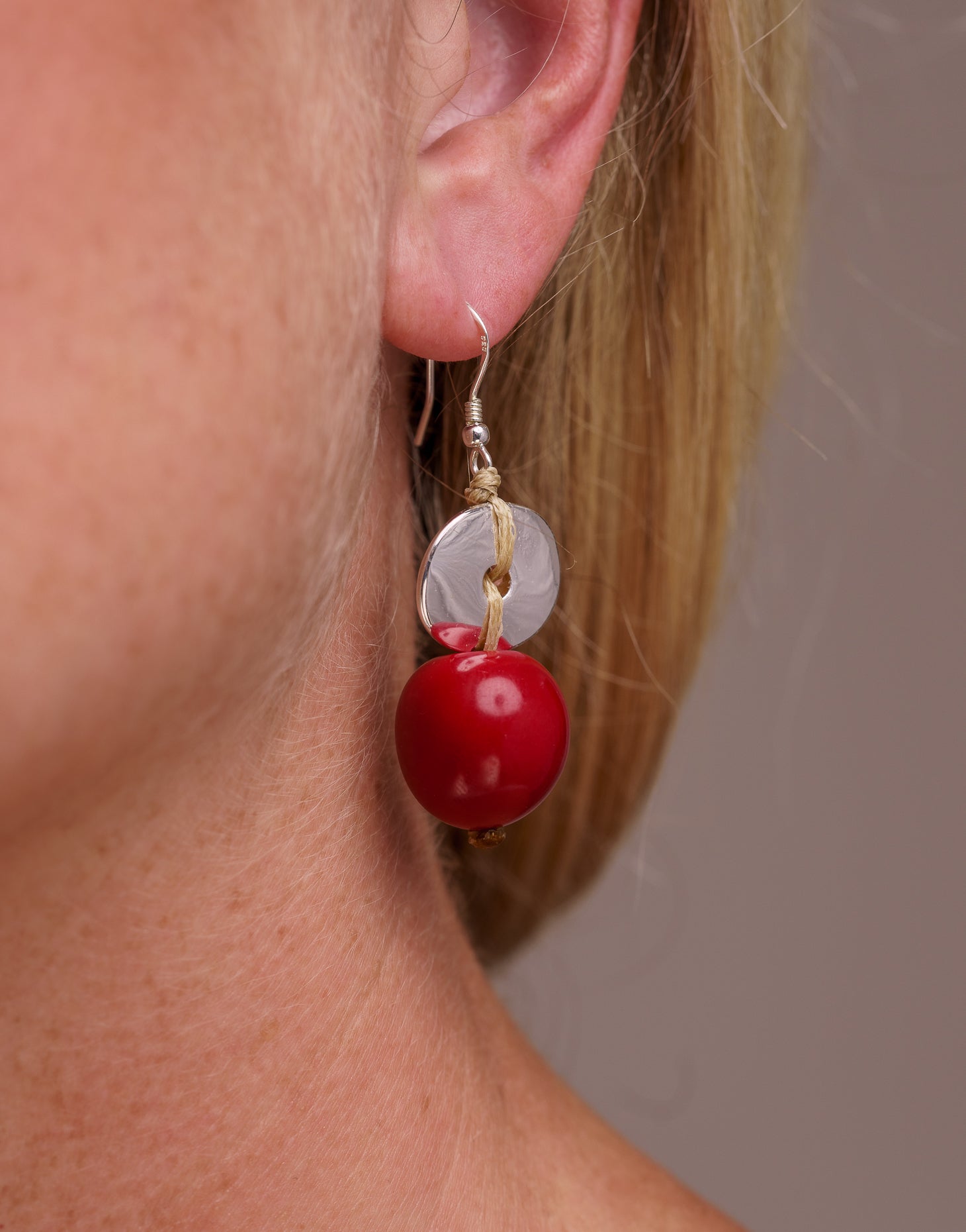 Baiana Bombona Earrings made from Vegetable Ivory and silver, featuring a round shape and sterling silver hooks.