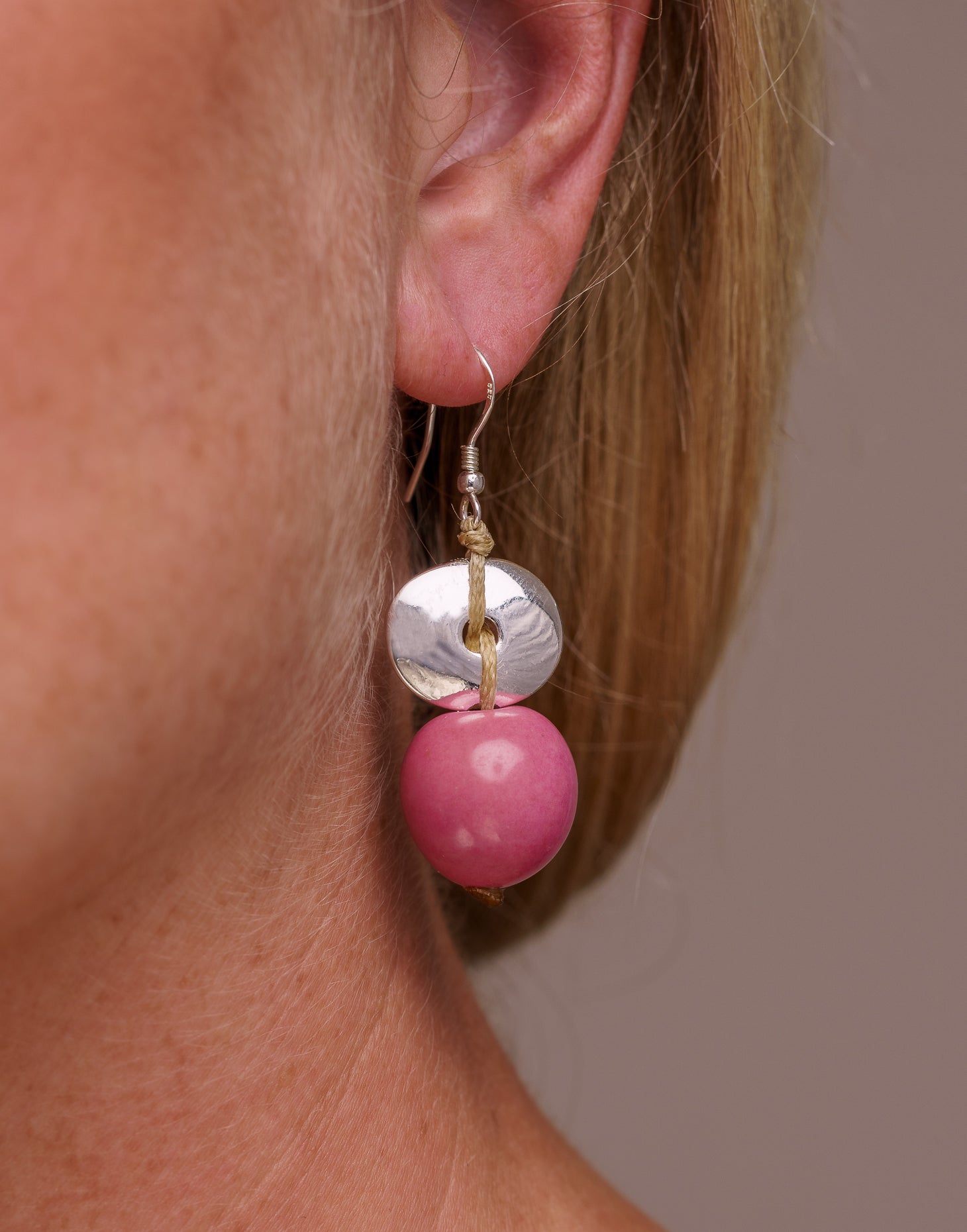 Baiana Bombona Earrings made from Vegetable Ivory and silver, featuring a round shape and sterling silver hooks.