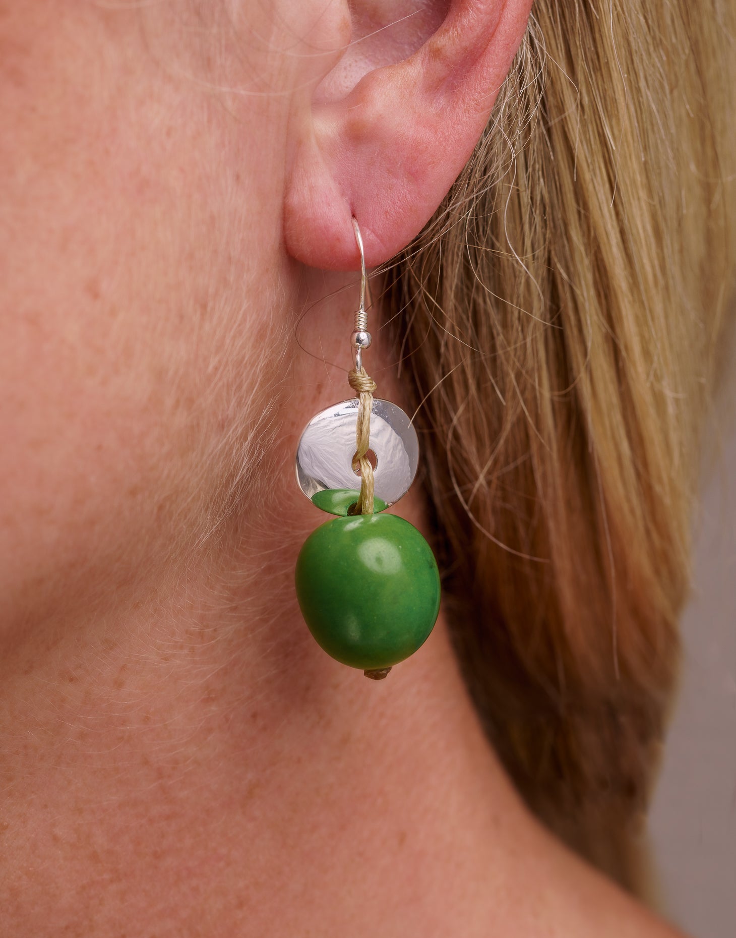 Baiana Bombona Earrings made from Vegetable Ivory and silver, featuring a round shape and sterling silver hooks.