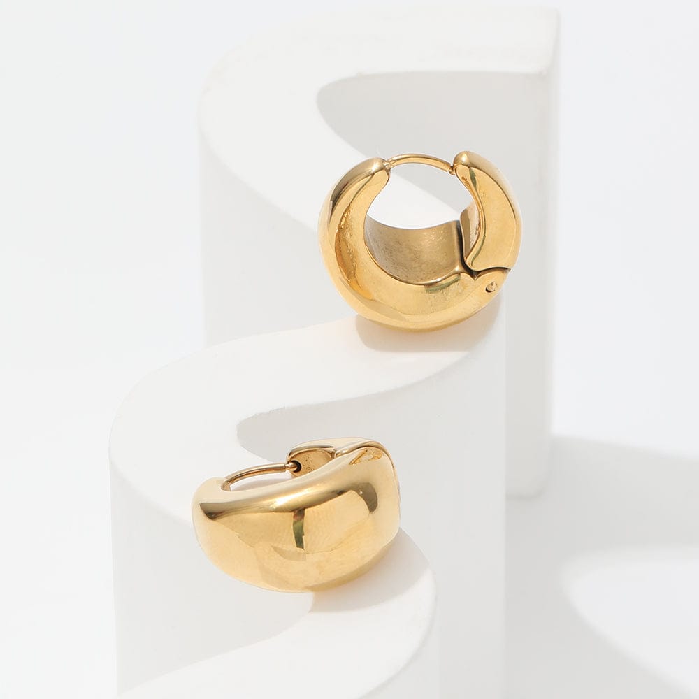 Baji Chunky Boat Polished Hoop Earrings in 18Kt yellow gold coating, showcasing a unique polished design.