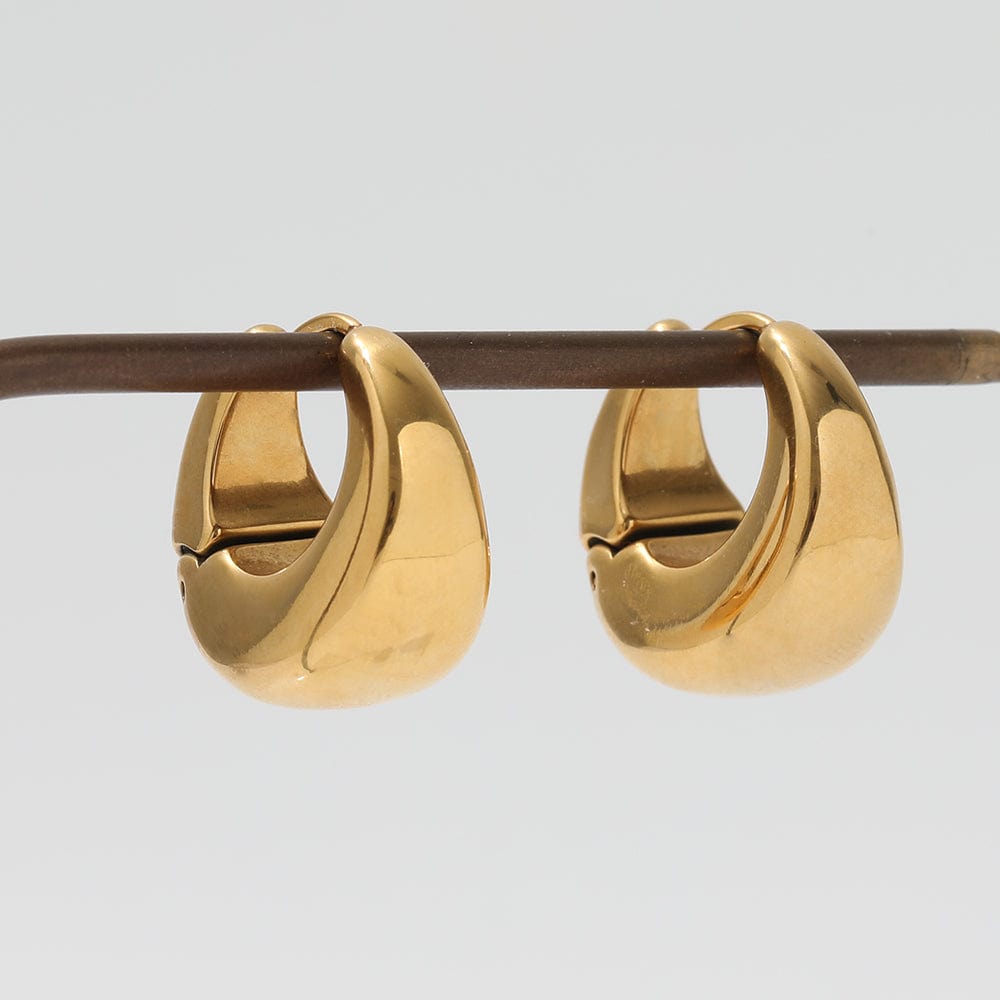 Baji Chunky Boat Polished Hoop Earrings in 18Kt yellow gold coating, showcasing a unique polished design.