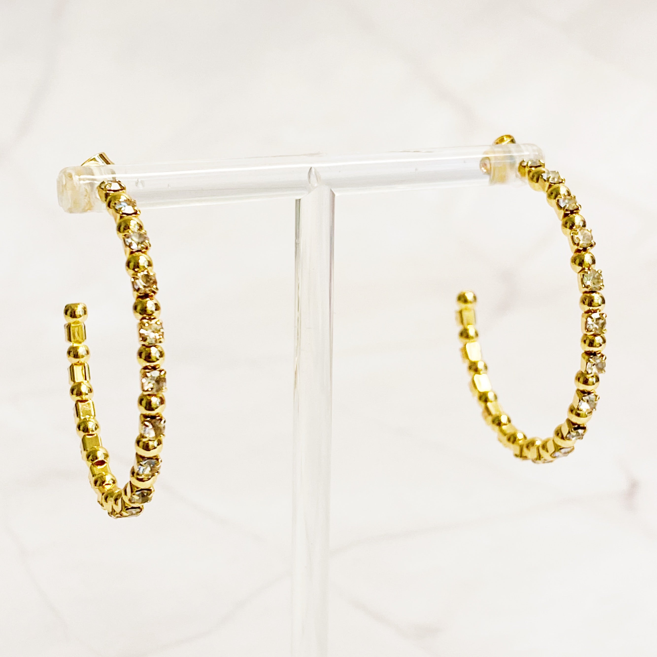 Elegant Ball and Jewel Hoop Earrings featuring golden balls and sparkling cubic zirconia stones, perfect for everyday wear.