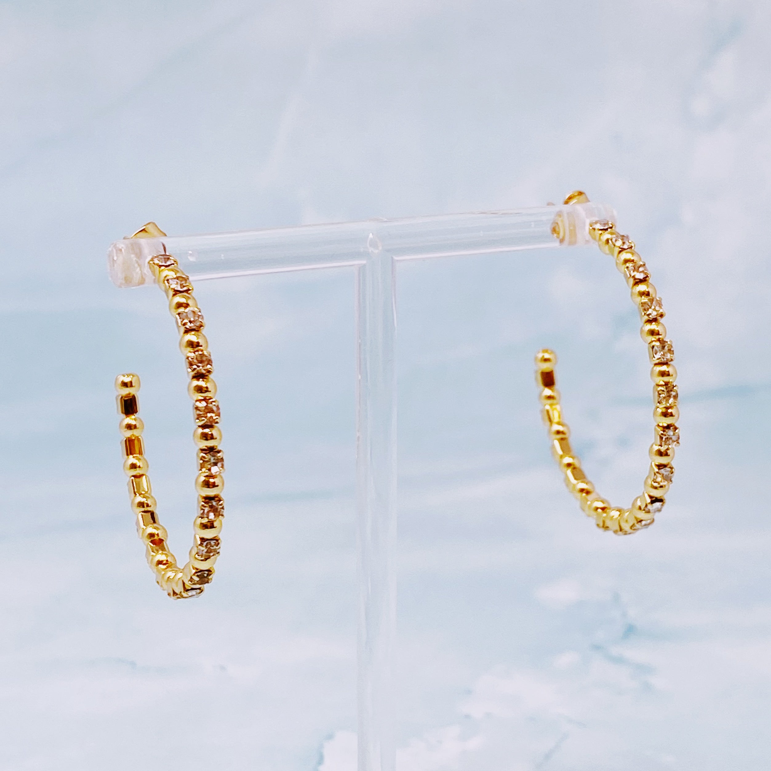 Elegant Ball and Jewel Hoop Earrings featuring golden balls and sparkling cubic zirconia stones, perfect for everyday wear.