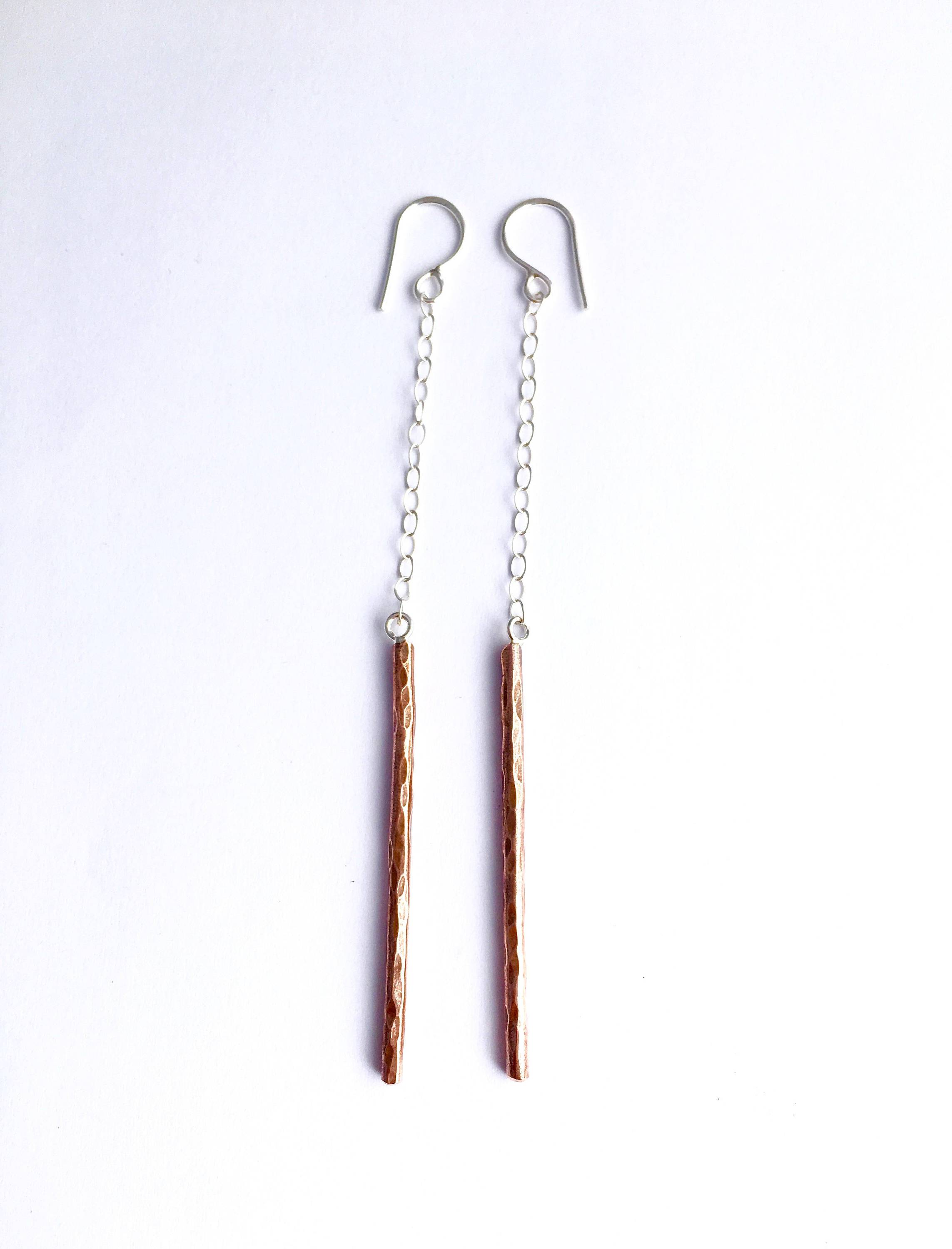 A pair of handmade Balance Earrings featuring rustic textured wire and a lightweight cable chain, available in various finishes.