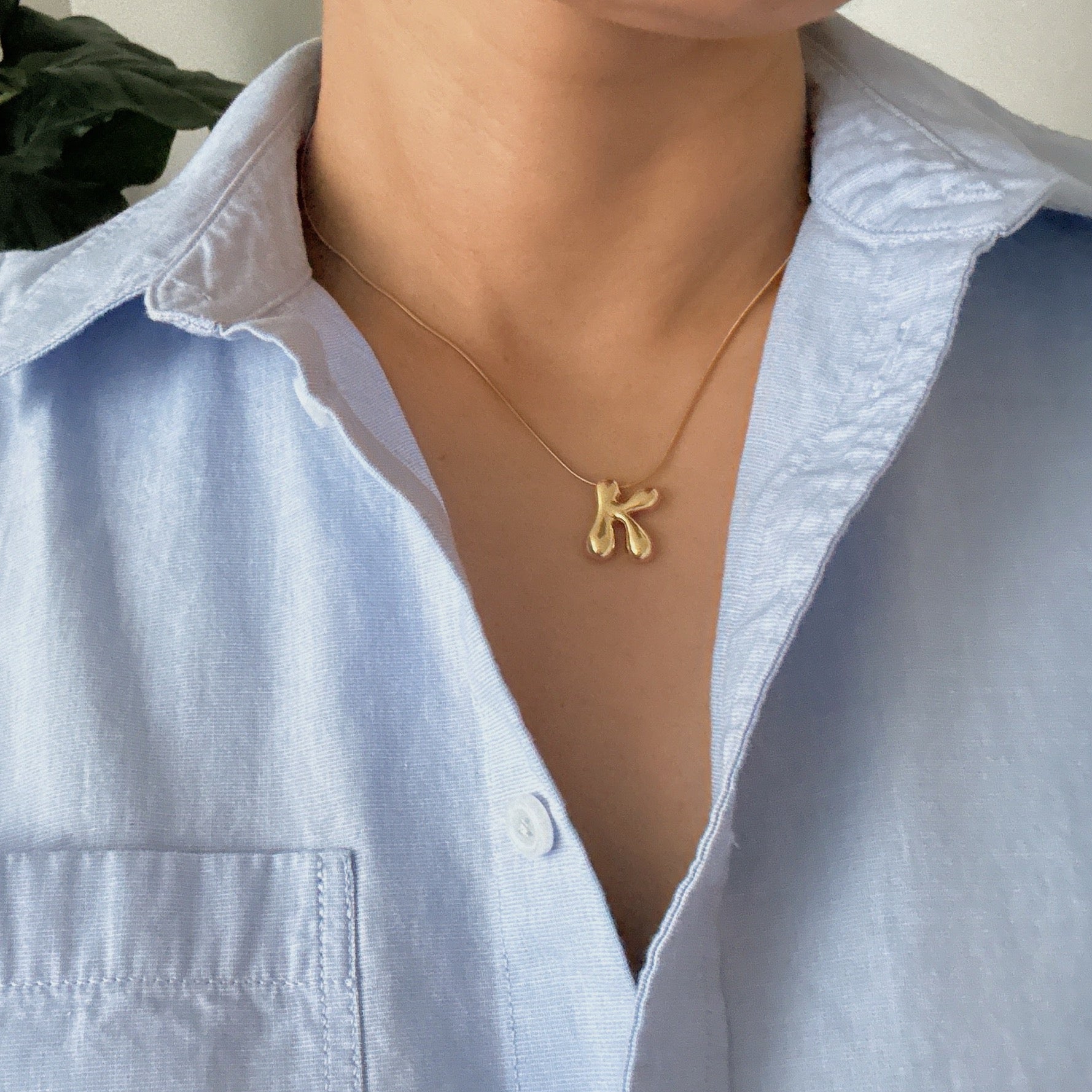 A stylish Balloon Letter Initial Necklace featuring a gold plated initial pendant on a delicate chain.