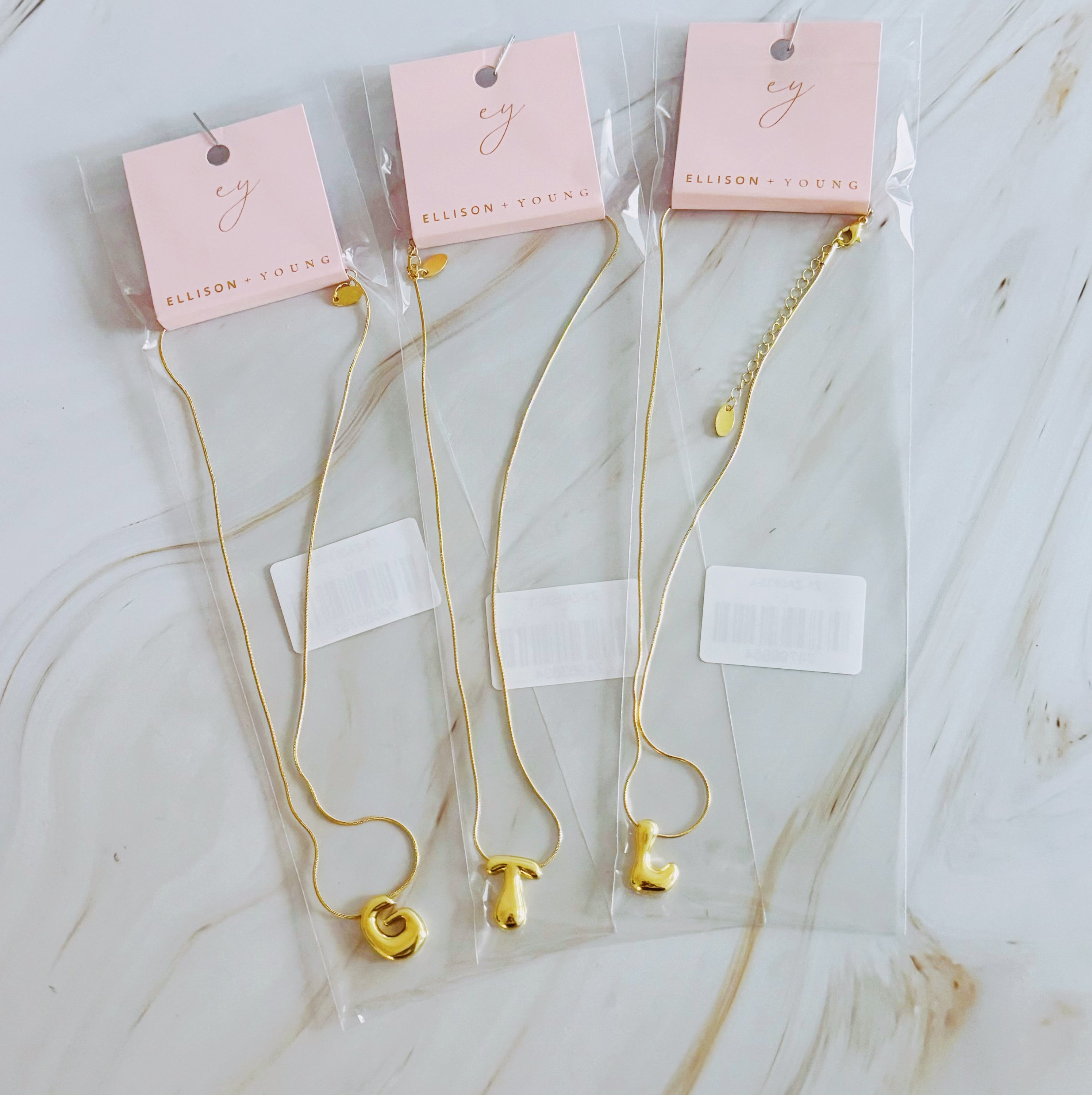 A stylish Balloon Letter Initial Necklace featuring a gold plated initial pendant on a delicate chain.