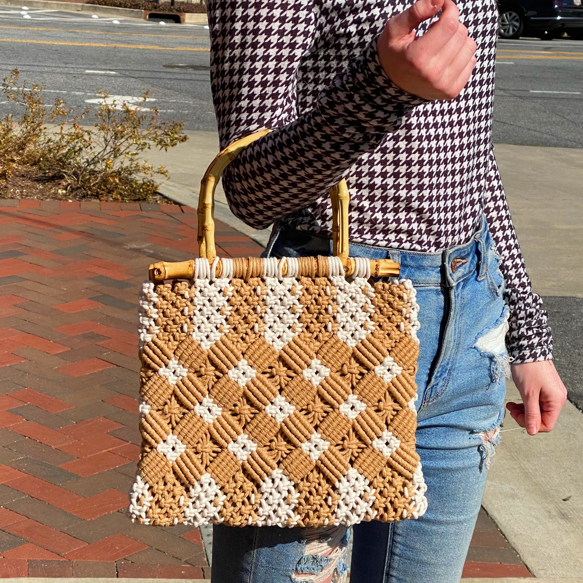 Bamboo Babe Tote featuring elegant bamboo handles and luxurious woven material in neutral colors.