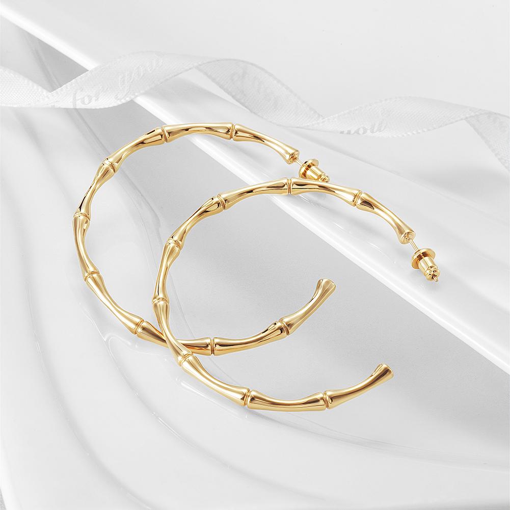 Stylish Bamboo Earhoops made from hypoallergenic stainless steel with 14K gold PVD plating, showcasing their elegant design.