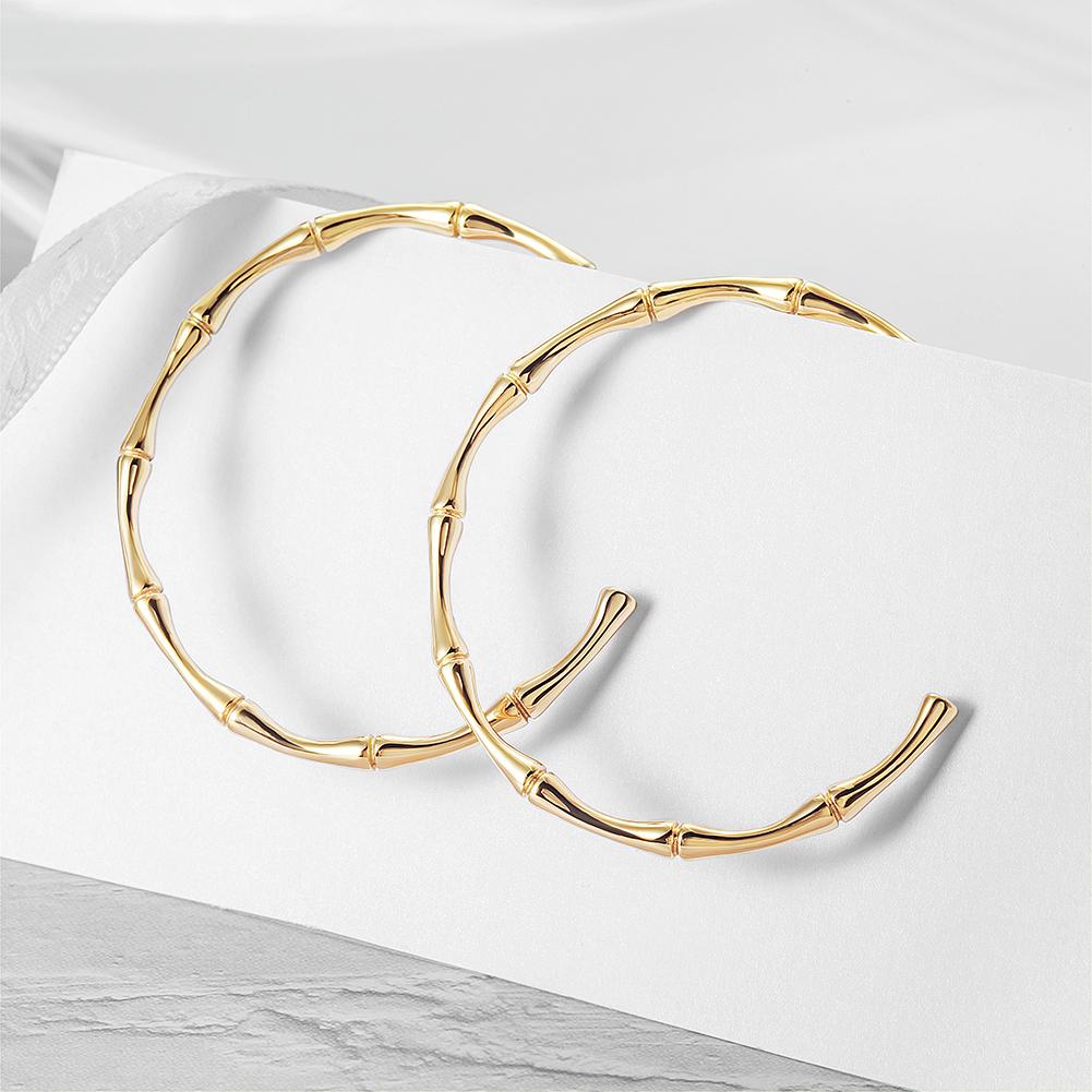 Stylish Bamboo Earhoops made from hypoallergenic stainless steel with 14K gold PVD plating, showcasing their elegant design.