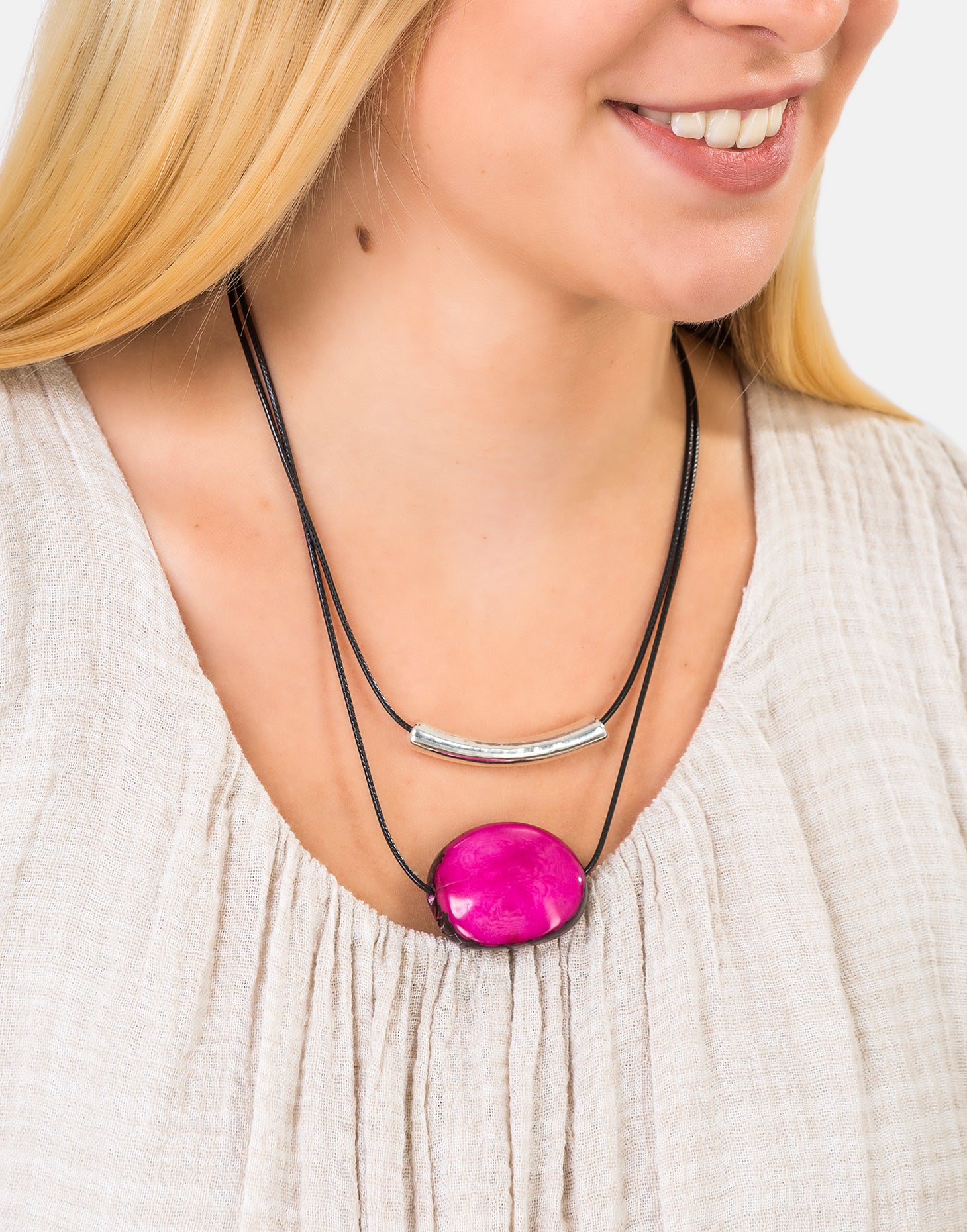 Barra Seed Necklace featuring a silver plated tube and flattened tagua nut, elegantly designed for versatile wear.