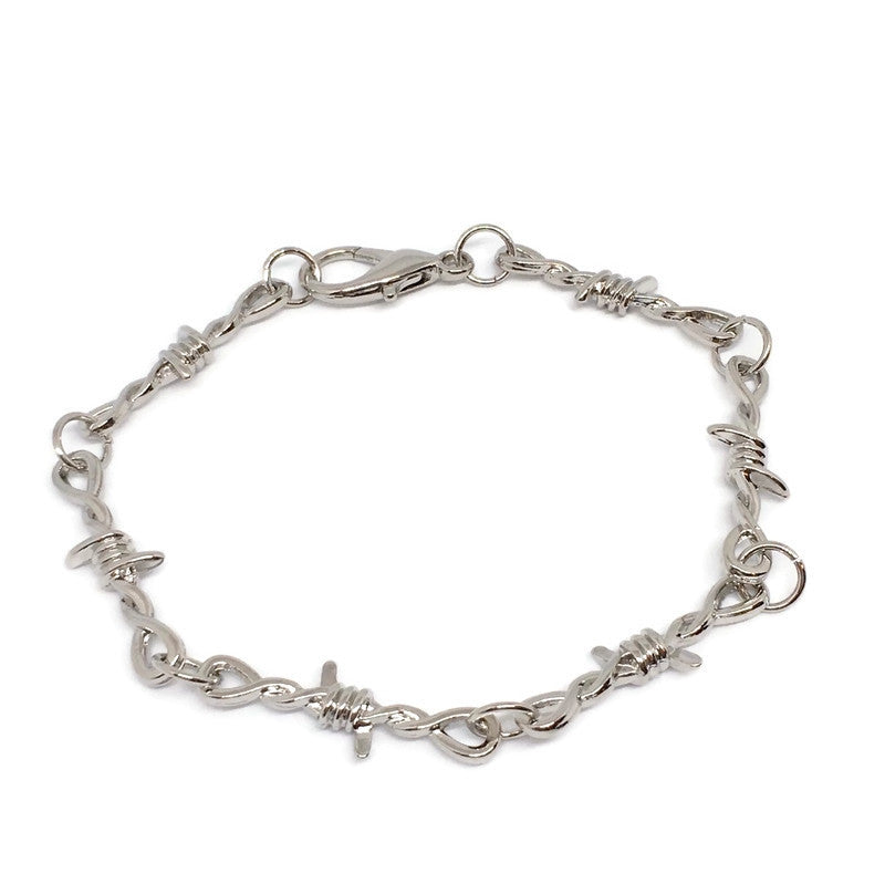 A stylish Barbed Wire Link Bracelet made of sterling silver plated steel alloy, featuring a unique barbed wire design.