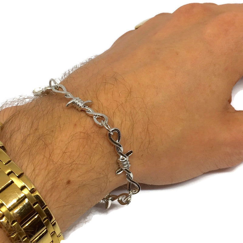 A stylish Barbed Wire Link Bracelet made of sterling silver plated steel alloy, featuring a unique barbed wire design.