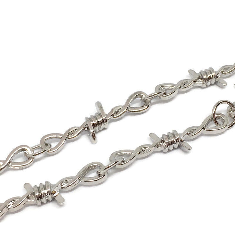 A stylish Barbed Wire Link Bracelet made of sterling silver plated steel alloy, featuring a unique barbed wire design.