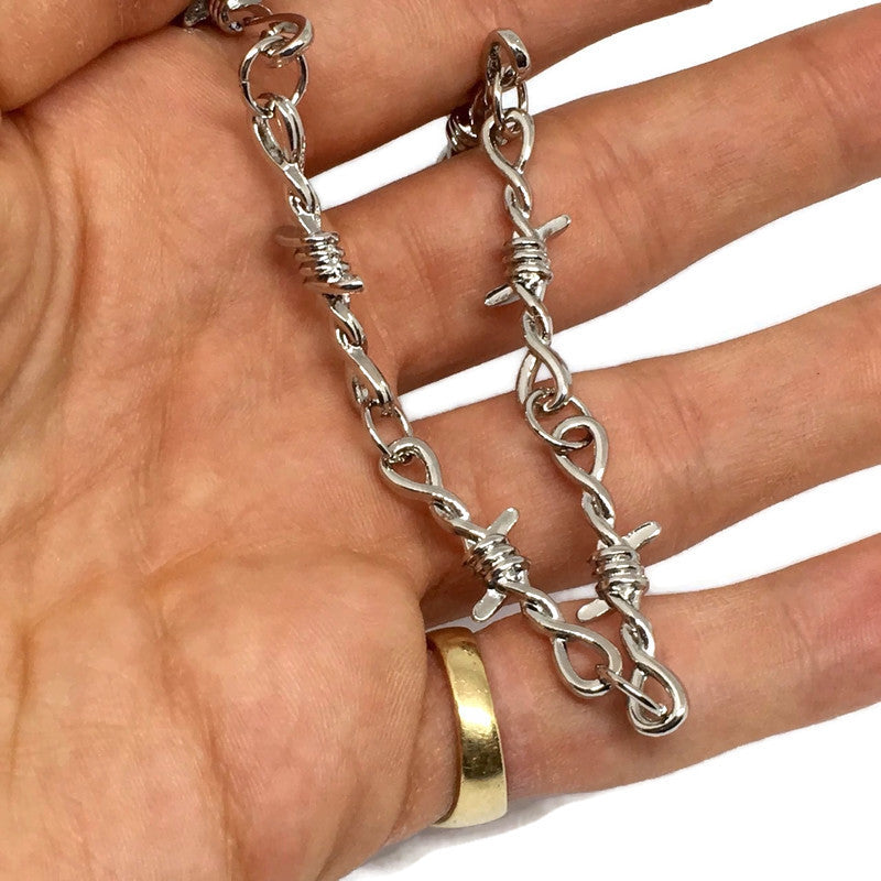 A stylish Barbed Wire Link Bracelet made of sterling silver plated steel alloy, featuring a unique barbed wire design.