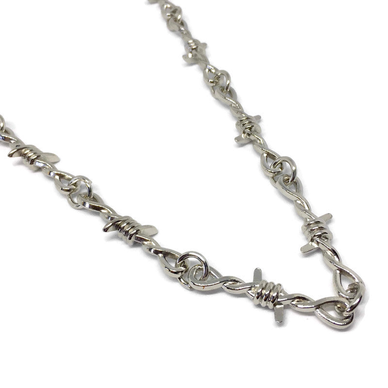 A stylish Barbed Wire Link Necklace made of stainless steel, featuring a unique barbed wire design, perfect for unisex wear.