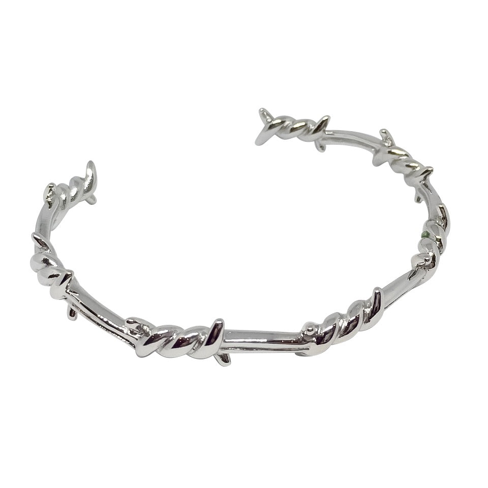 A stylish Barbed Wire Open-Cuff Bangle made of 18ct gold plated titanium steel, showcasing its unique design and adjustable fit.