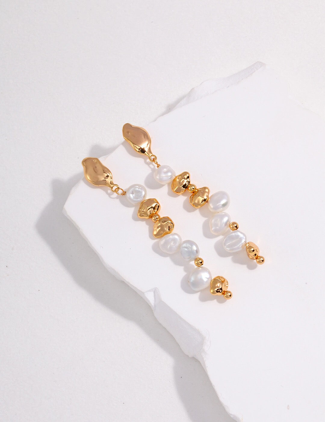 Elegant Baroque Pearl Dangle Beaded Earrings featuring natural pearls and gold vermeil, showcasing unique shapes and luxurious design.